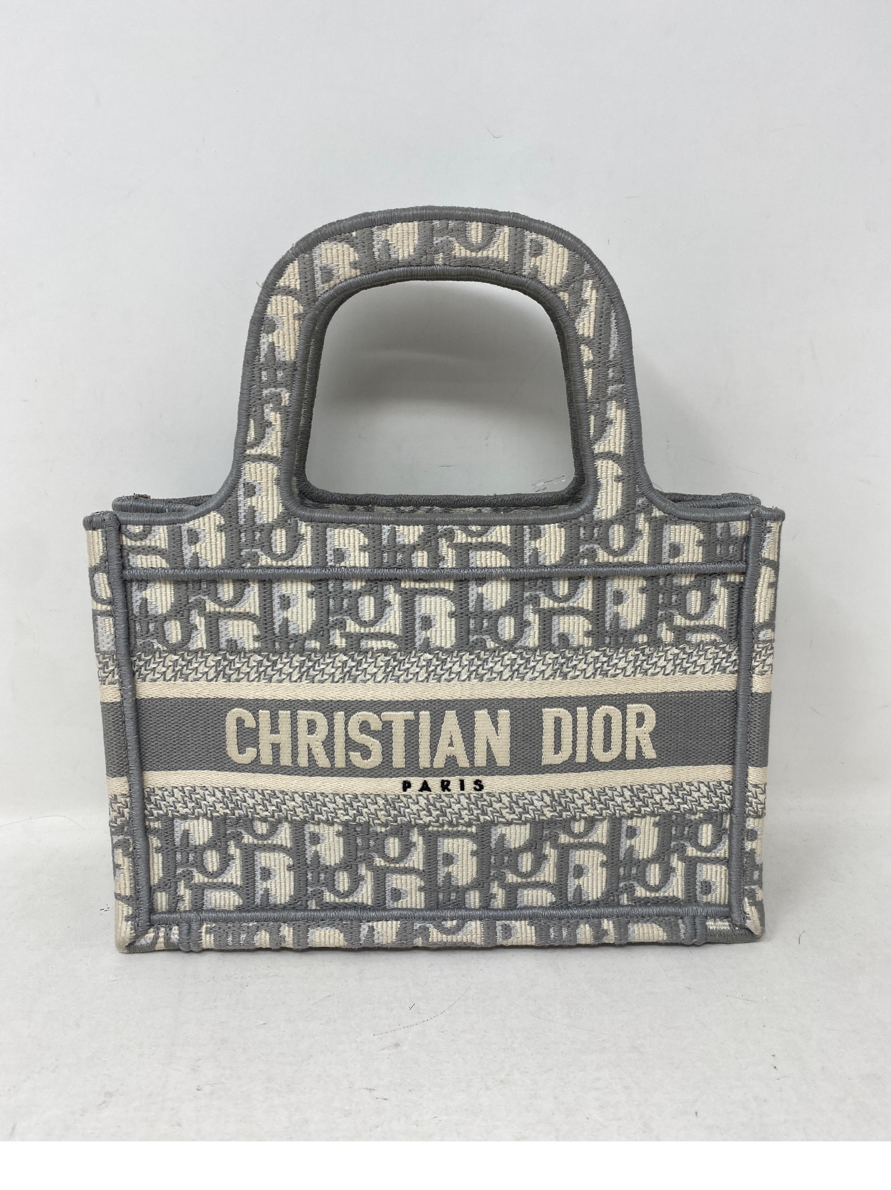 Christian Dior Mini Grey Book Tote Bag. Mint like new condition. Rare size Dior mini bag. Includes dust bag. Guaranteed authentic. 