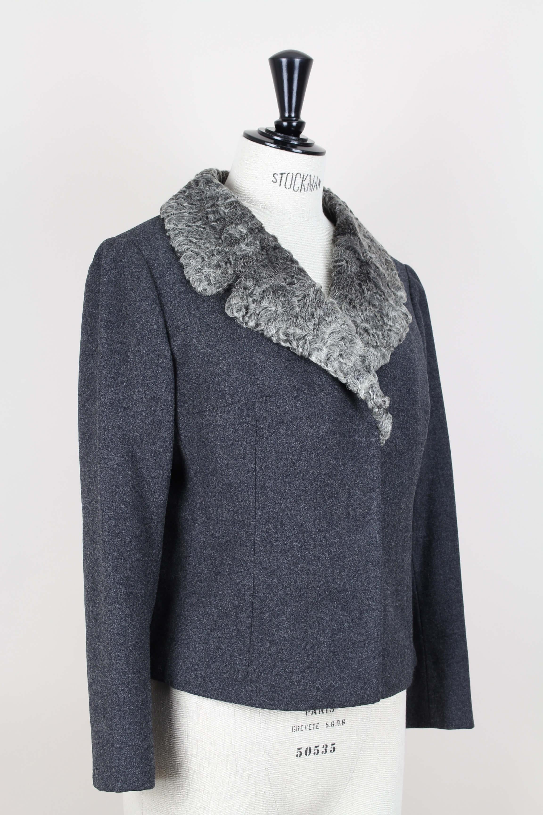 Chic and rare Christian Dior little box cut jacket with a lush Persian lamb fur collar, most likely from the early 1960s.

The silhouette is very minimum in design, with the emphasis on the luxe silky-soft Persian lamb fur collar in various shades