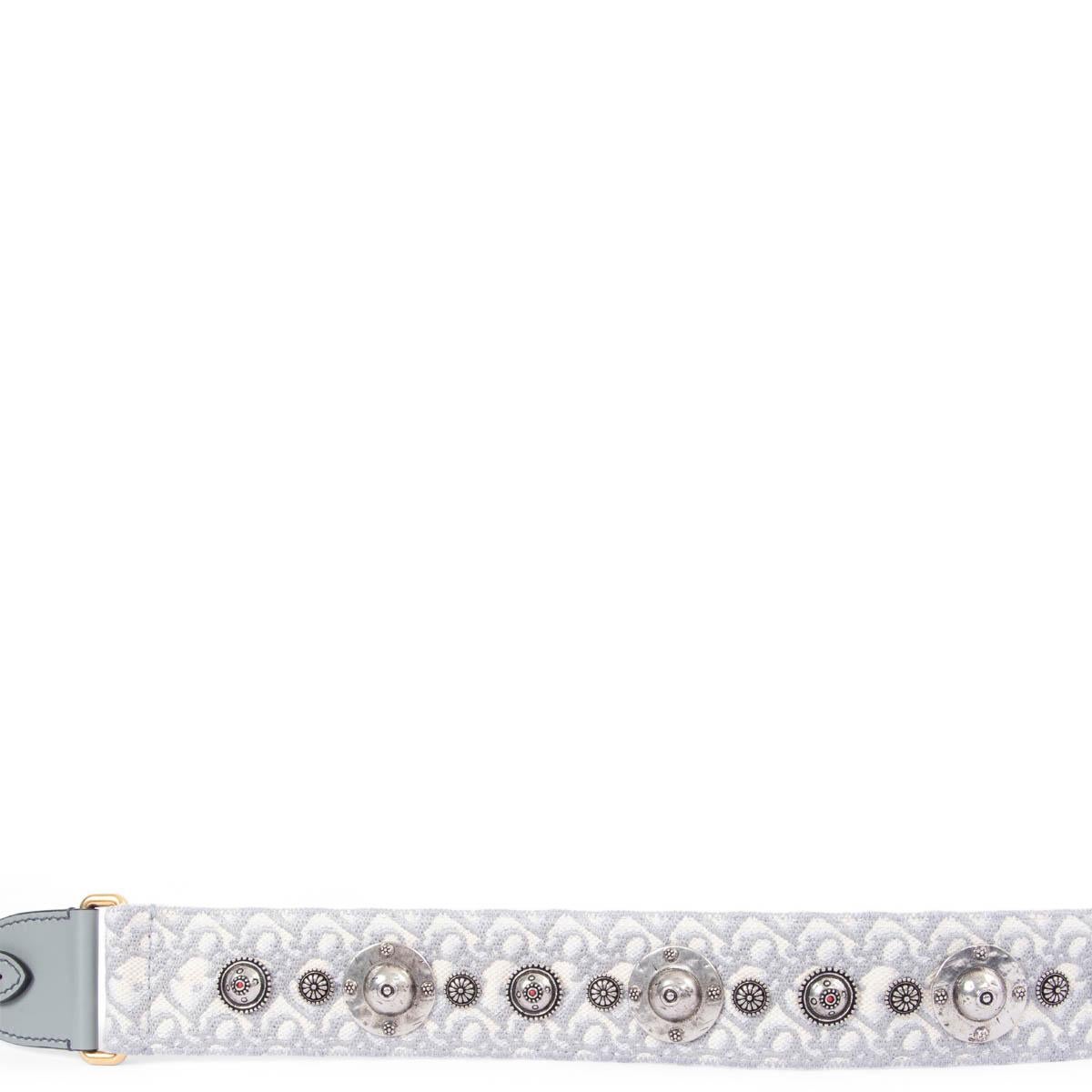 100% authentic Christian Dior silver-tone studded metal emblems Dior Oblique belt strap in light grey and ecru canvas featuring gold-tone clasps with light grey leather trimming. Has been carried and is in excellent condition.