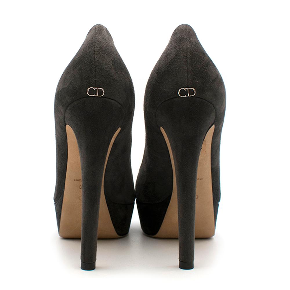 Christian Dior grey suede platform pumps featuring a semi pointed toe and silver toned CD symbol on back

- Made in Italy

Please note, these items are pre-owned and may show signs of being stored even when unworn and unused. This is reflected