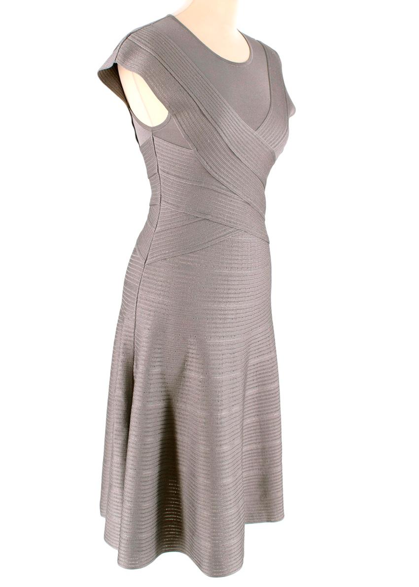 Christian Dior Grey Textured Knit Flared Dress

- Made of soft fresh knit 
- Gorgeous classic cut 
- Crossover striped texture 
- Round neckline 
- Flared skirt 
- Zip fastening to the side 
- Neutral grey hue 
- Timeless elegant design