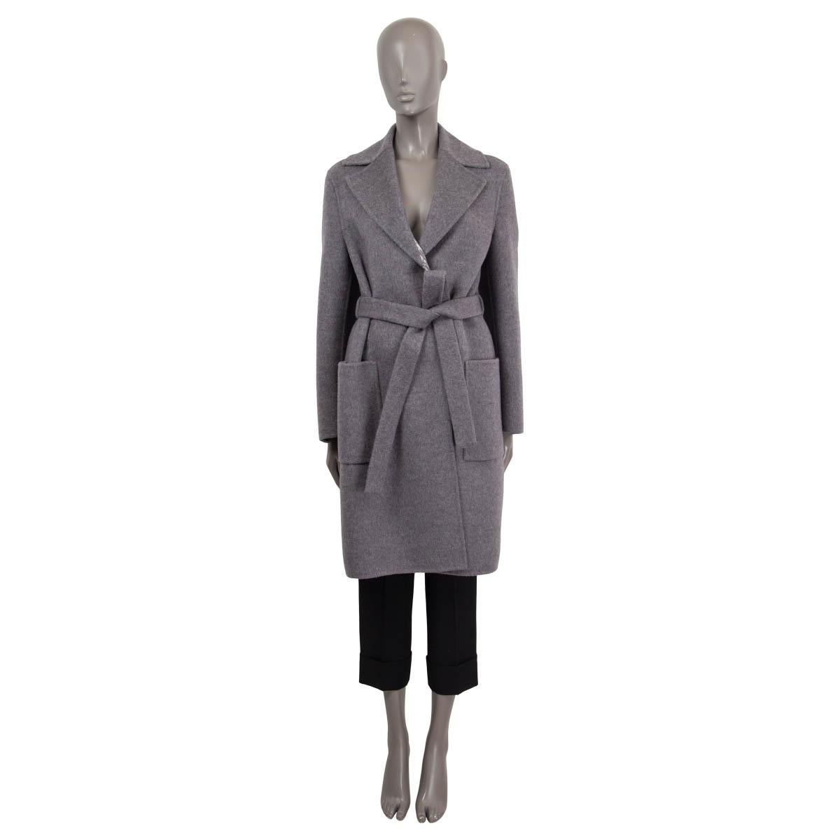 100% authentic Christian Dior 2021 double sided coat in gray wool (99%) and silk (1%) (please note content tag is missing). Features two patch pockets on the front, long sleeves and the Dior monogram in gray and off-white on the inside. Opens with a