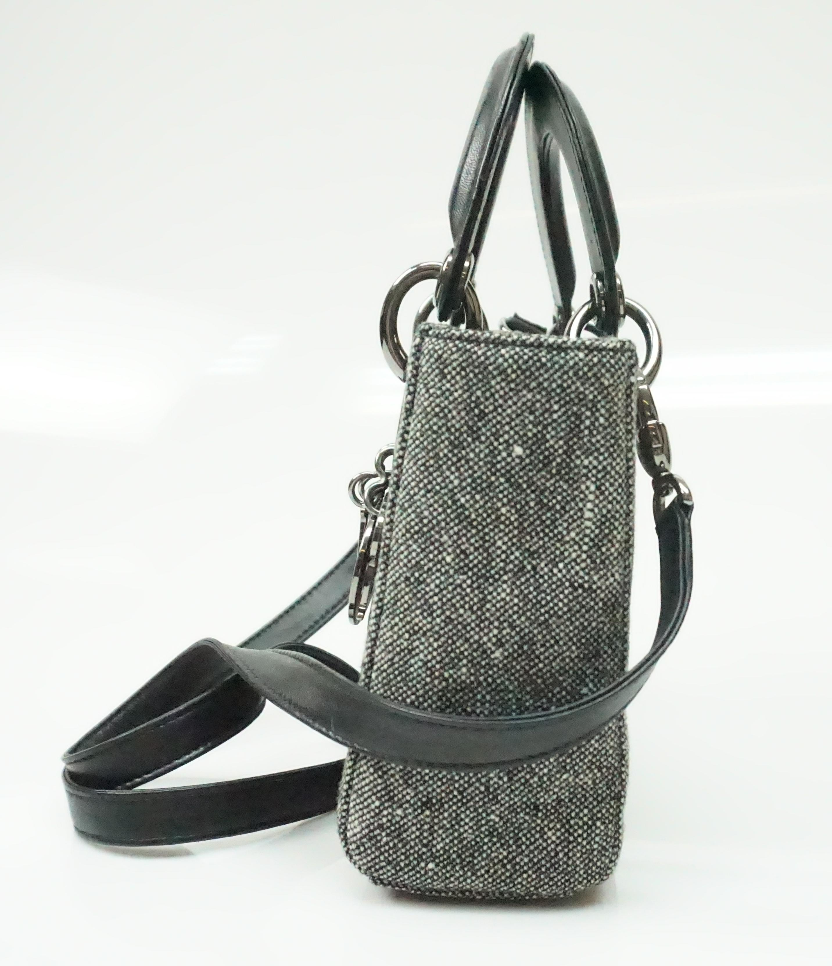 CHRISTIAN DIOR grey wool mini lady dior bag. This amazing mini lady dior bag is in excellent condition. It has barely any sign of use. The bag is made of grey wool and has leather handles along with a detachable leather cross-body strap. The front