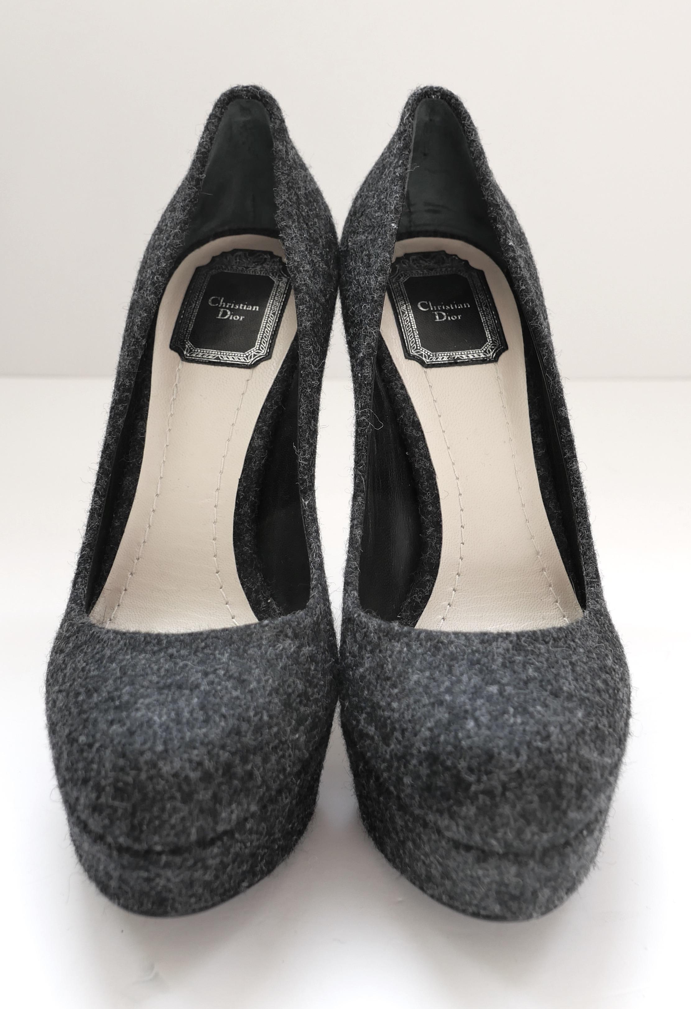 Fabulous Christian Dior grey wool platform heels. Unworn. Made from textured grey wool, they have snubbed toes, covered platforms, stiletto heels and little silver CD badges to backs. Size 38.5. Measure approx - heel to toe 10”, platform 1.25” and