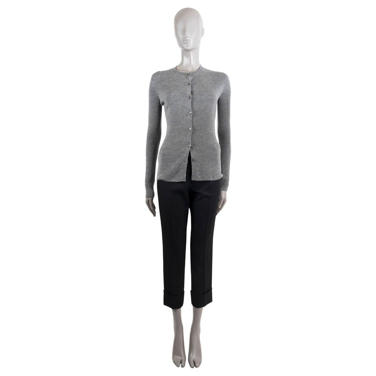 100% authentic Christian Dior cardigan in grey wool (70%) and silk (30%). Closes with buttons on the front. Unlined. Has been worn and is in excellent condition.

2015 Pre-Fall 

See separate listing for matching sweater