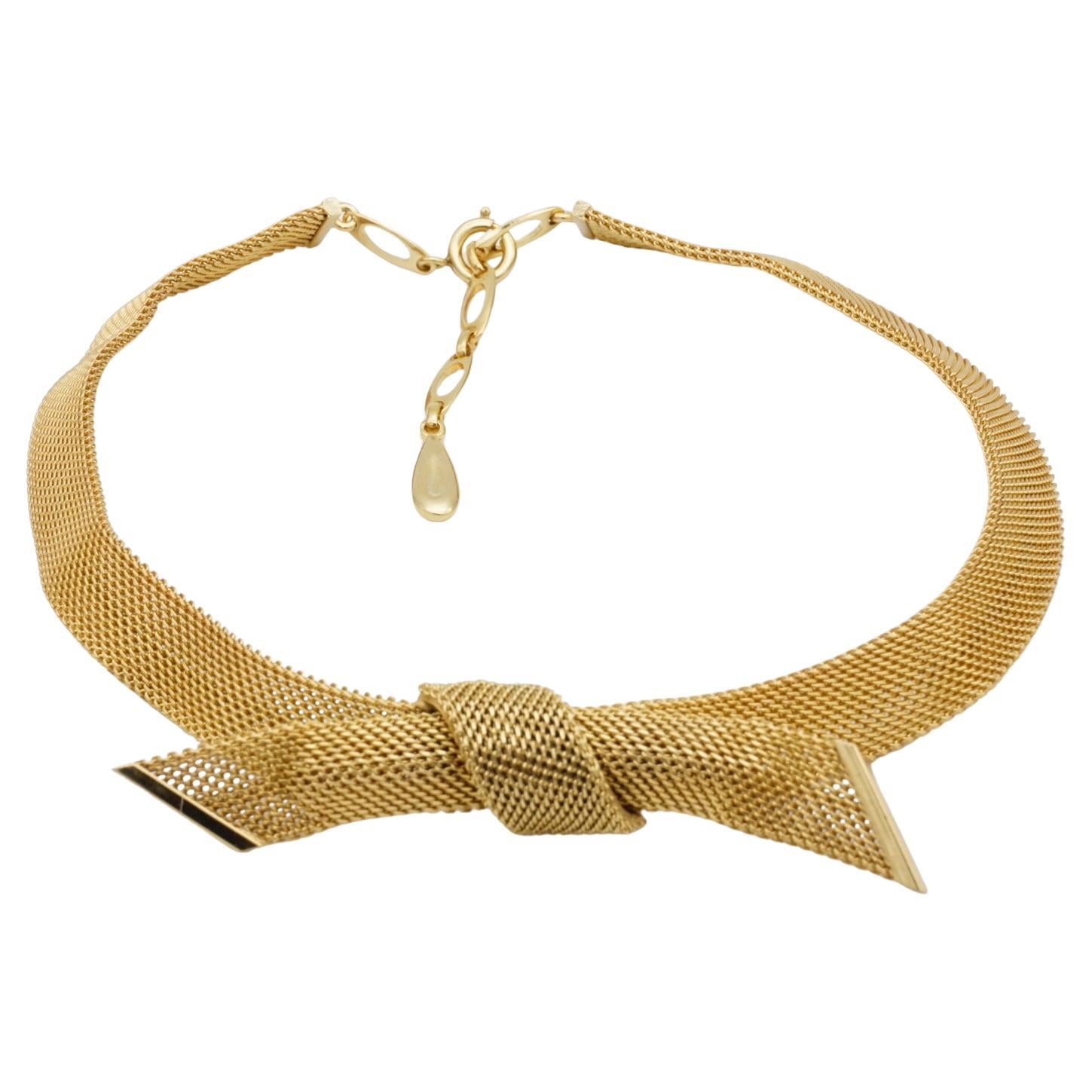 Christian Dior GROSSE 1958 Vintage Large Bow Ribbon Butterfly Pendant Mesh Woven Omega Chunky Choker Collar Necklace, Gold Plated

Very excellent condition. Signed at at back. 100% Genuine. 

Very beautiful. Very rare to find.

Material: Gold plated