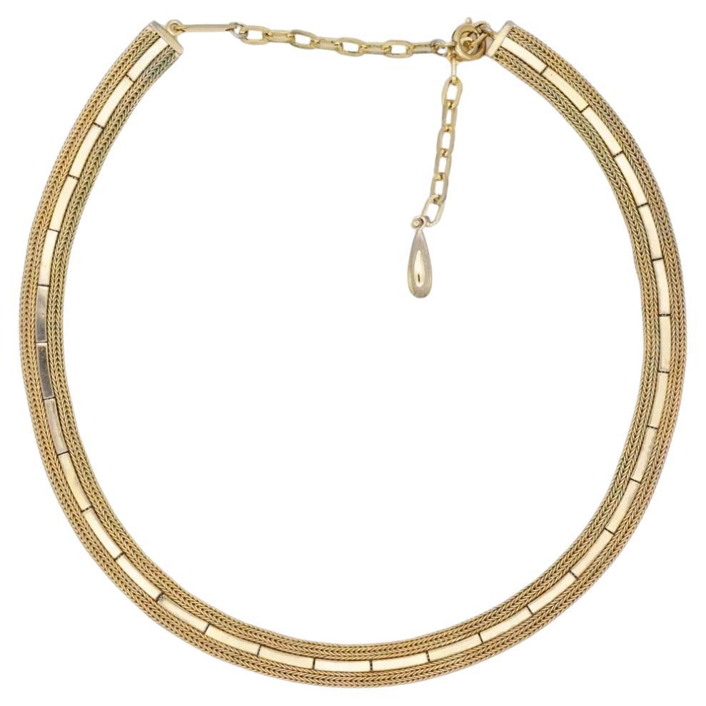 Christian Dior GROSSE 1961 Vintage Unisex Woven Interlinked Herringbone Choker Chain Necklace, Gold Plated

Very good condition. Light scratches or colour loss, barely noticeable. 

Signed at clasp. 100% Genuine. Rare to find.

Material: Gold plated