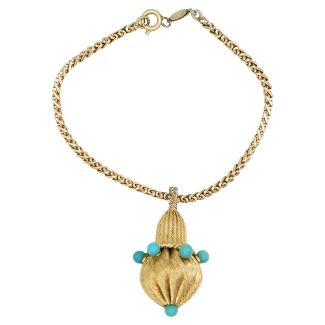 Christian Dior GROSSE 1962 Vintage Unisex Turquoise Light Green Blue Beads Ball Light Charm Drop Pendant Bracelet, Gold Tone

Pendant is very excellent condition, which can be removable. Also can be used as necklace pendant. Sale the bracelet and