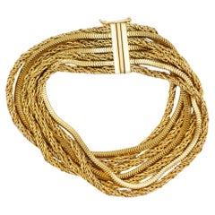 Christian Dior GROSSE 1963 7strängiges, mehrreihiges, gedrehtes Schlangenarmband aus Gold mit Kette und Seil