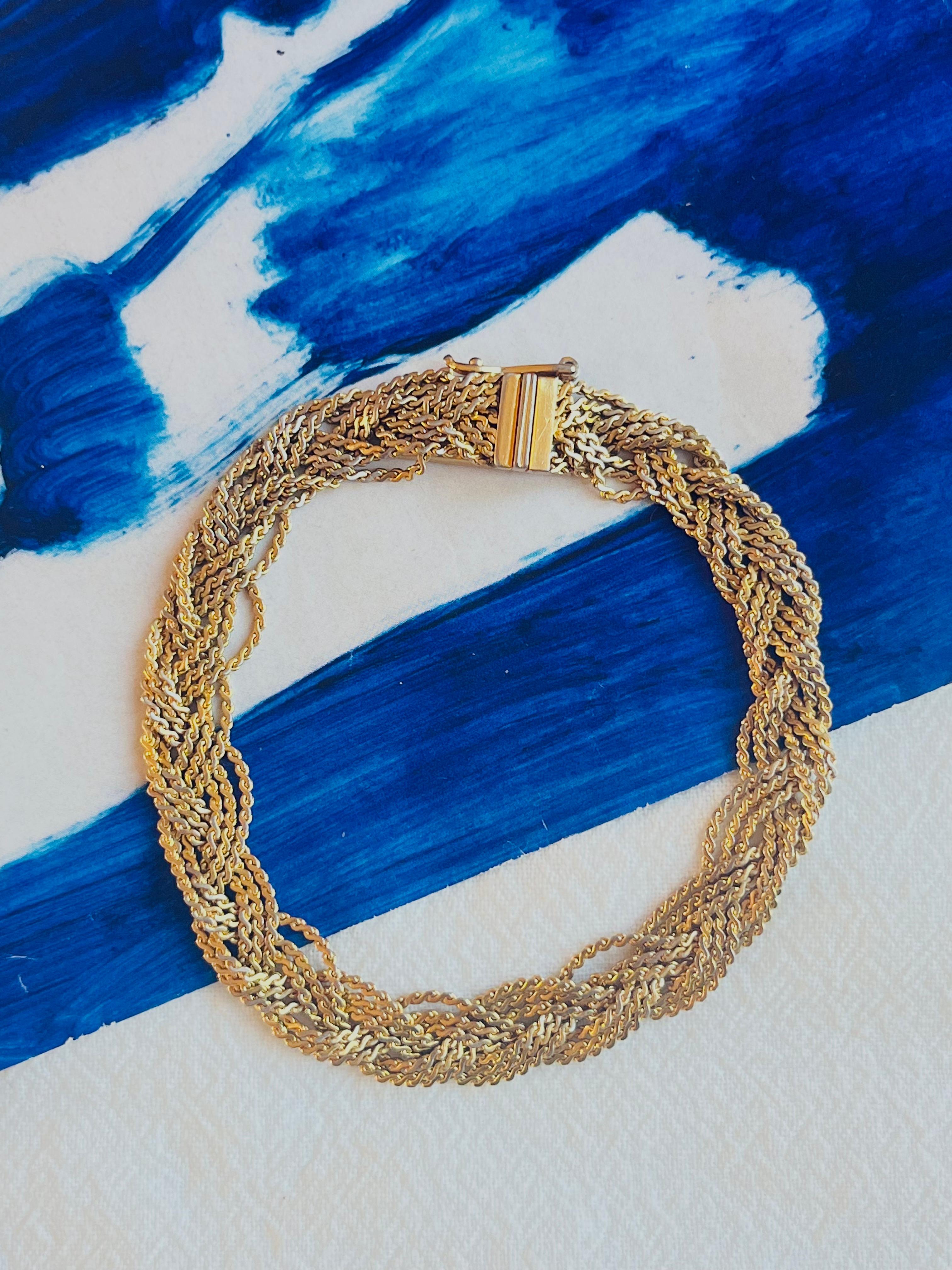 Christian Dior GROSSE 1963 Unisex Braided Woven Twisted 3 Triple Strands Rope Bracelet, Gold Tone

A very beautiful bracelet by GROSSE, signed at the back.

Very good condition. Some light scratches or colour loss. 100% Genuine.

Size: 19.5 *0.9