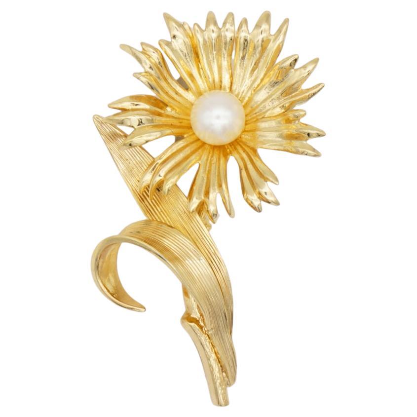 Christian Dior GROSSE 1965 Vintage Vivid Flourish Sunflower Floral Curled Leaf White Pearl Brooch, Gold Tone

Very excellent condition. 100% Genuine. A unique piece. 

This gold plated stylised brooch. Safety-catch pin closure, signed on the