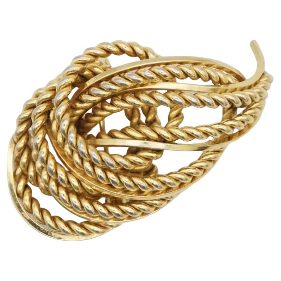 Christian Dior GROSSE 1968 durchbrochene Knoten Blatt Wirbel Seil Feuer Modernist Brosche, Gold-Ton

Sehr guter Zustand. 100% echt.

Ein Unikat. Diese stilisierte Brosche ist vergoldet. Verschluss mit Sicherheitsnadel, signiert auf der