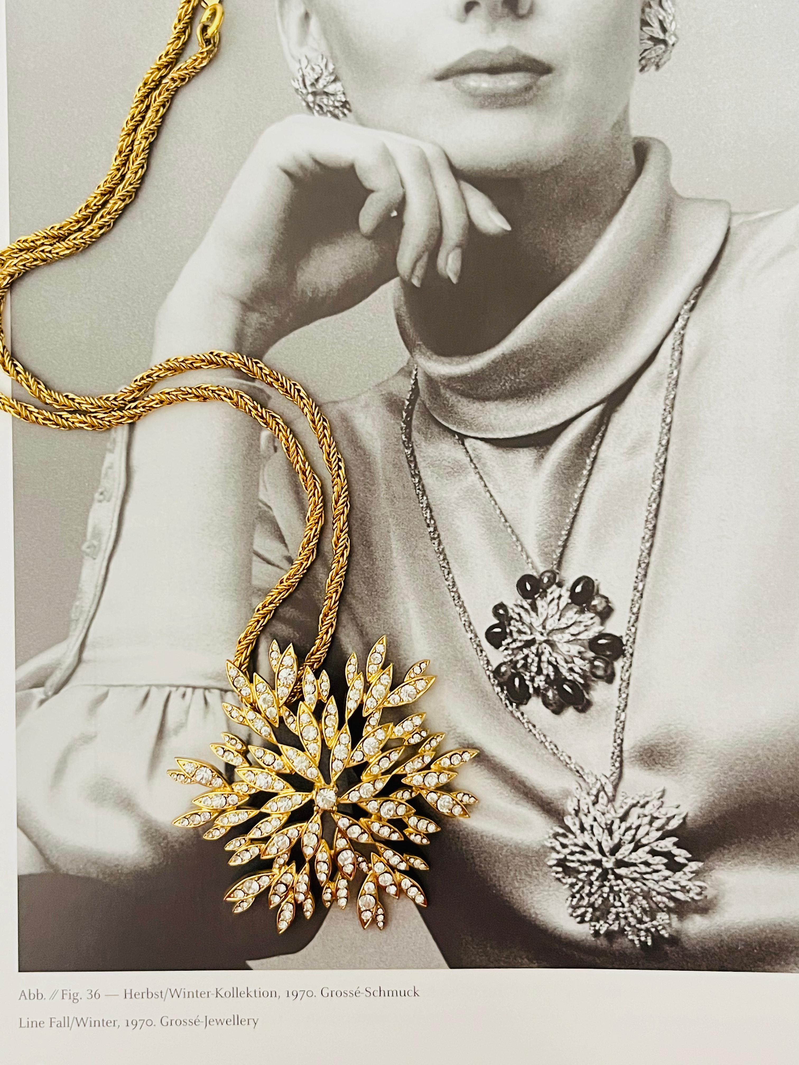 Christian Dior GROSSE 1970 Vintage Large Snowflake Whole Sparkling Clear Crystals Flower Pendant Chain Necklace, Gold Tone

Very good condition. Maybe light scratches or colour loss. Many tiny rhinestones, if some one lost, please glue a new, but