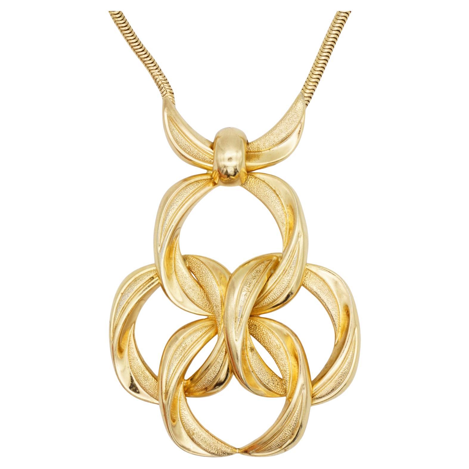 Christian Dior GROSSE 1972 Vintage Massive Huge Extra Large Textured Clover Flower Oval Interlocked Openwork Pendant Modernist Necklace, Gold Tone

Very good condition. 100% Genuine. 

Marked at back of the pendant. Very rare to find.

Material: