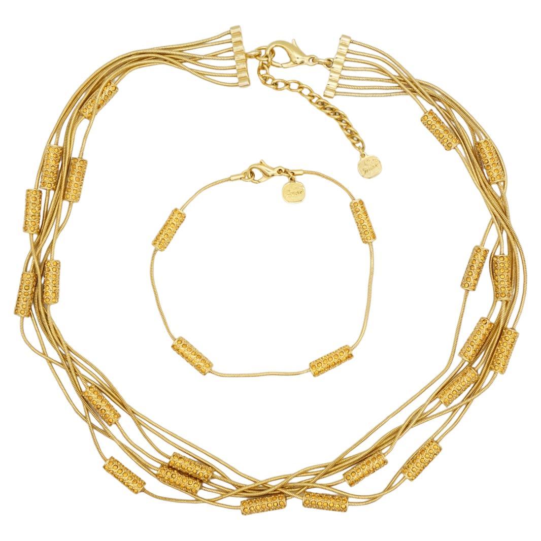 Christian Dior GROSSE 1970s Vintage Citrine Yellow Crystals Bar Six Strands Layers Necklace Bracelet Jewellery Set, Gold Tone

Very excellent condition. 100% Genuine. 

Vintage and rare to find. Signed at clasp.

Material: Gold plated metal,