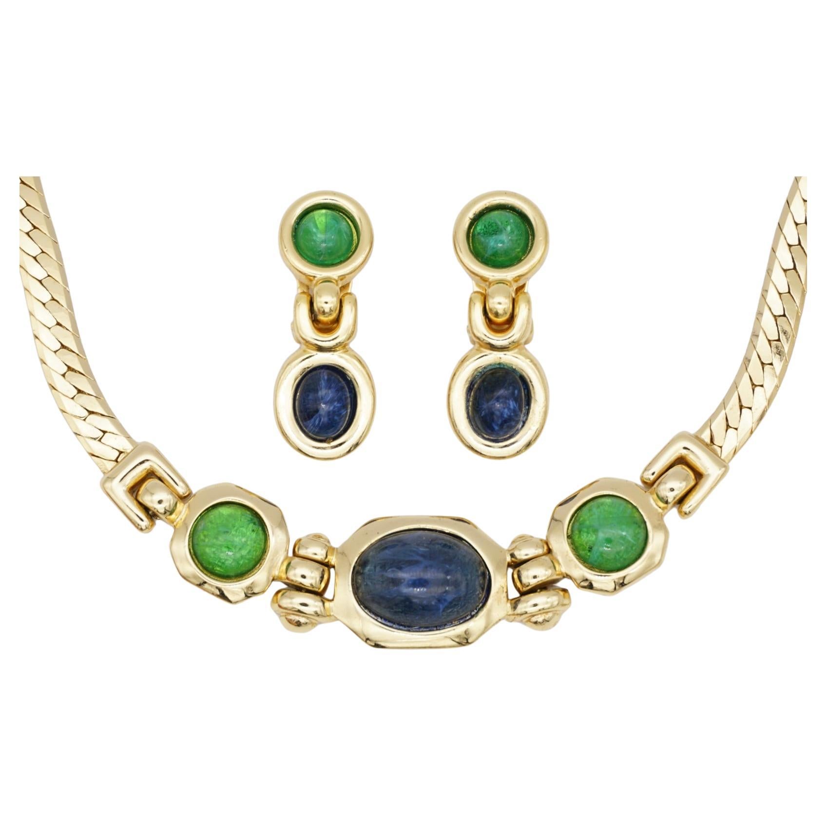 Christian Dior GROSSE Vintage Emerald Sapphire Navy Blue Green Cabochon Crystals Dangle Drop Necklace Earrings Jewellery Set, Gold Tone

Very excellent condition. 100% Genuine. Vintage and rare to find. 

A very beautiful jewellery set, signed at