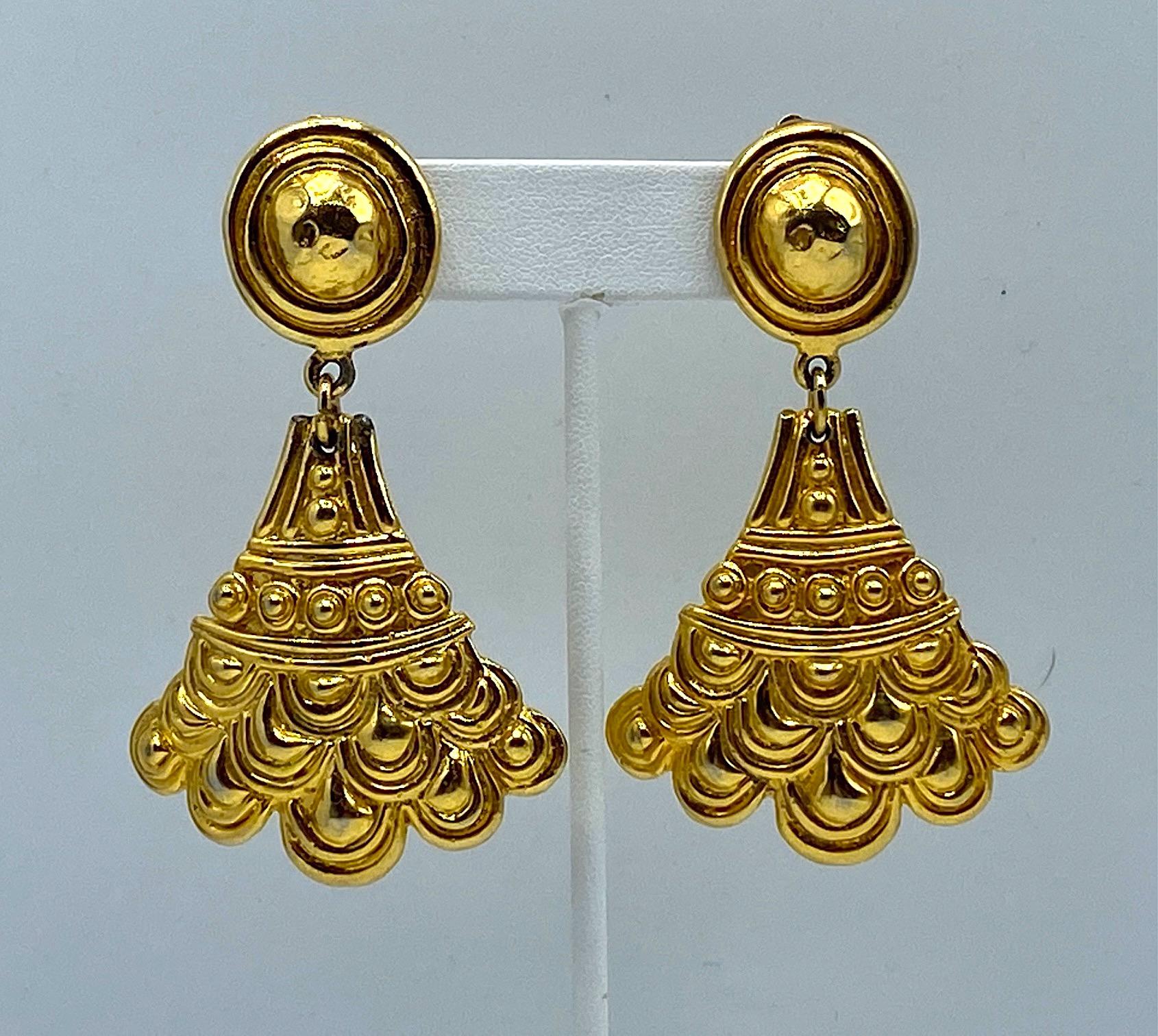 A marvelous and rare pair of ancient Etruscan revival style earrings from the 1970s by Christian Dior. Each part of the earring is meticulously carved and cast with beadwork and a scallop design typical of ancient Etruscan jewelry. The earrings are