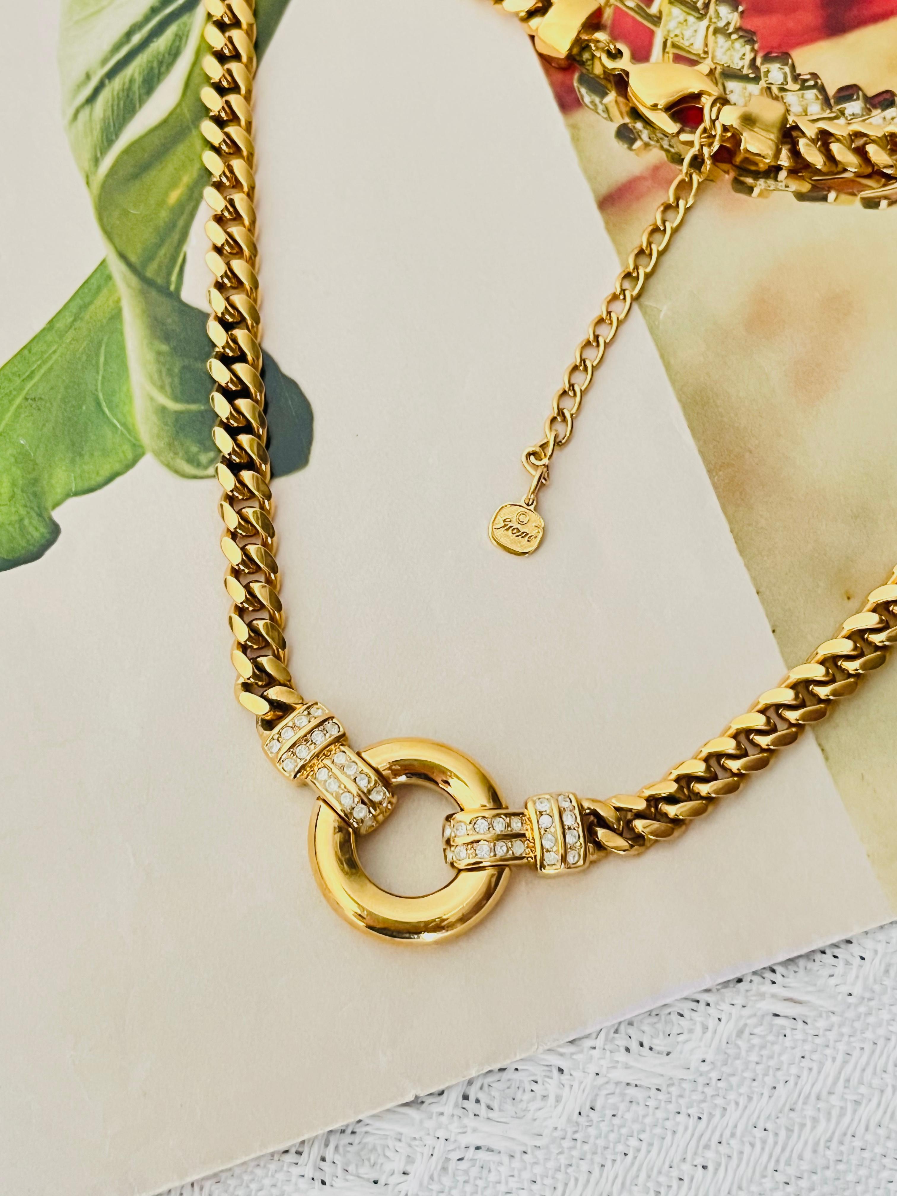 Christian Dior GROSSE 1970s Unisex Glow Circle Round Ring Crystals Door Knocker Pendant Cuban Chain Snake Omega Modernist Elegant Necklace, Gold Plated

Very excellent condition. Not any stones lost. 100% Genuine. 

Rare to find. Signed at