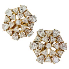 Pendientes grandes y llamativos de Christian Dior GROSSE, con un icónico copo de nieve dorado de alta costura
