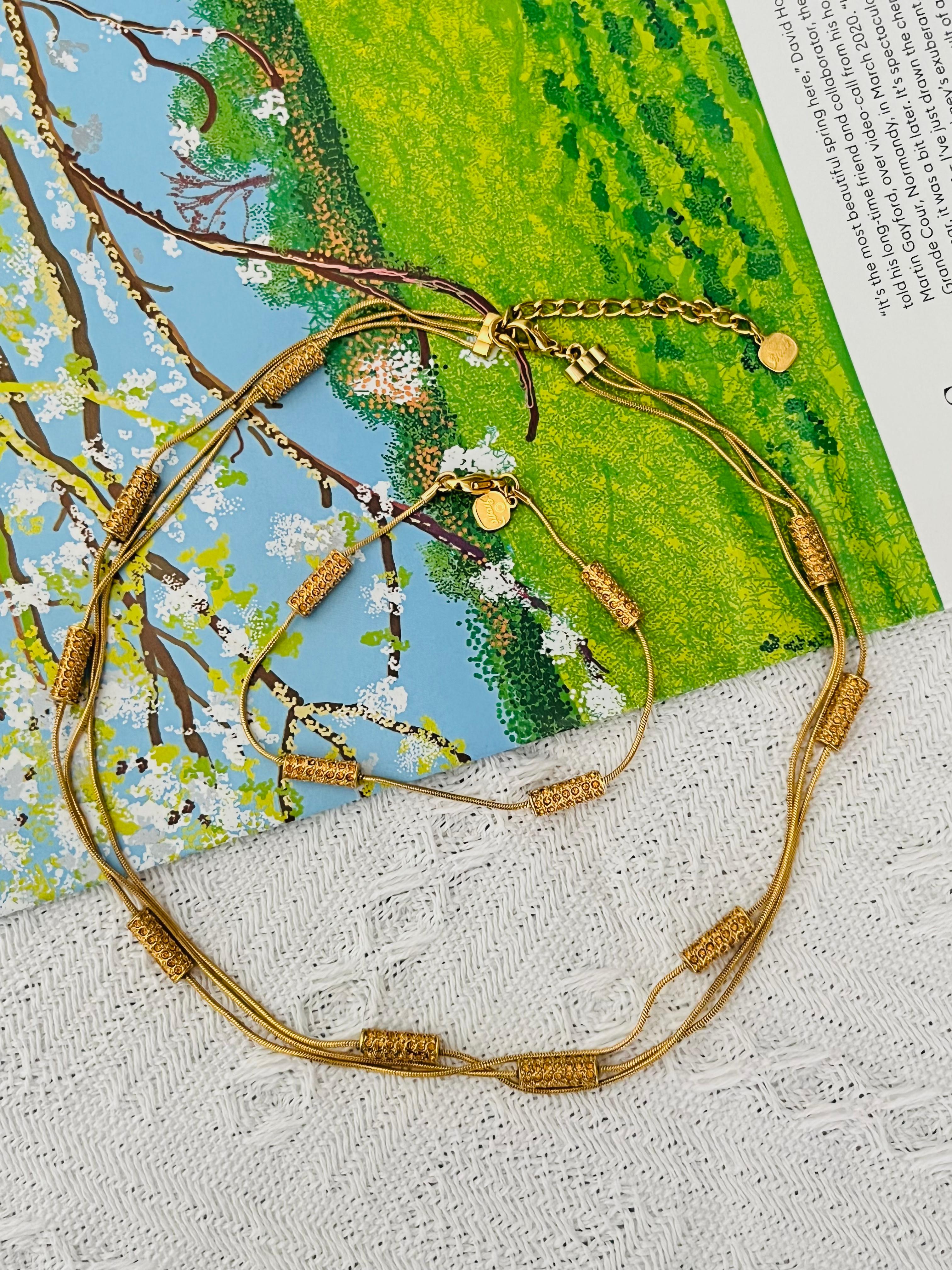 Christian Dior GROSSE Vintage Unisex Trio 3 Three Layers Strands Citrine Yellow Crystals Bar Charms Elegant Modernist Necklace Bracelet Jewellery Set, Gold Tone

Très bon état. 100% authentique. 

Vintage et rare à trouver. Signé sur le