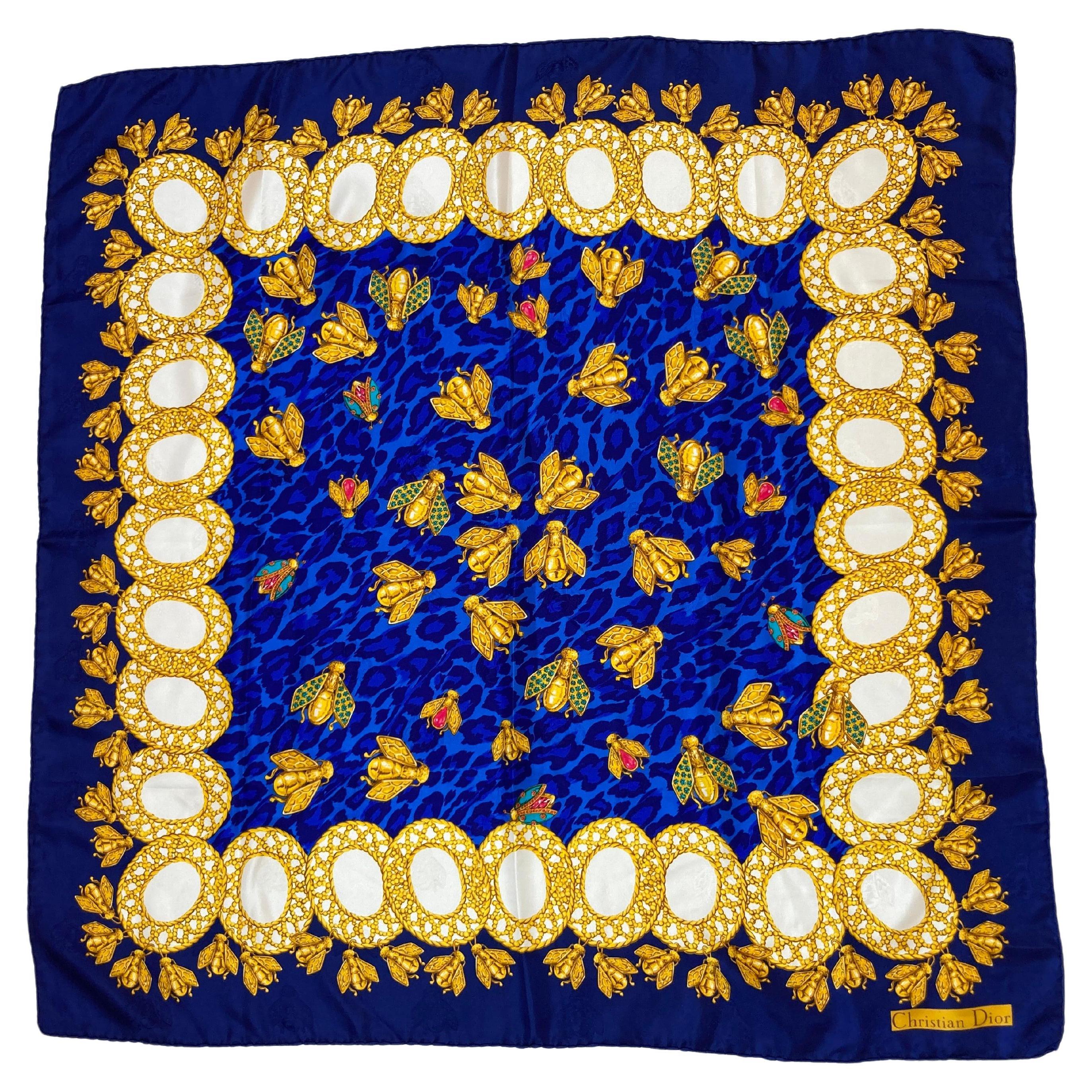 Christian Dior Hand Rolled Silk Scarf.
1990s CHRISTIAN DIOR Silk vintage scarf blue and gold.
This is a wonderful luxury silk scarf, the colors are a mix of royal blue, gold, red, white.
The theme is royal bees, with bees in gold and jeweled colors