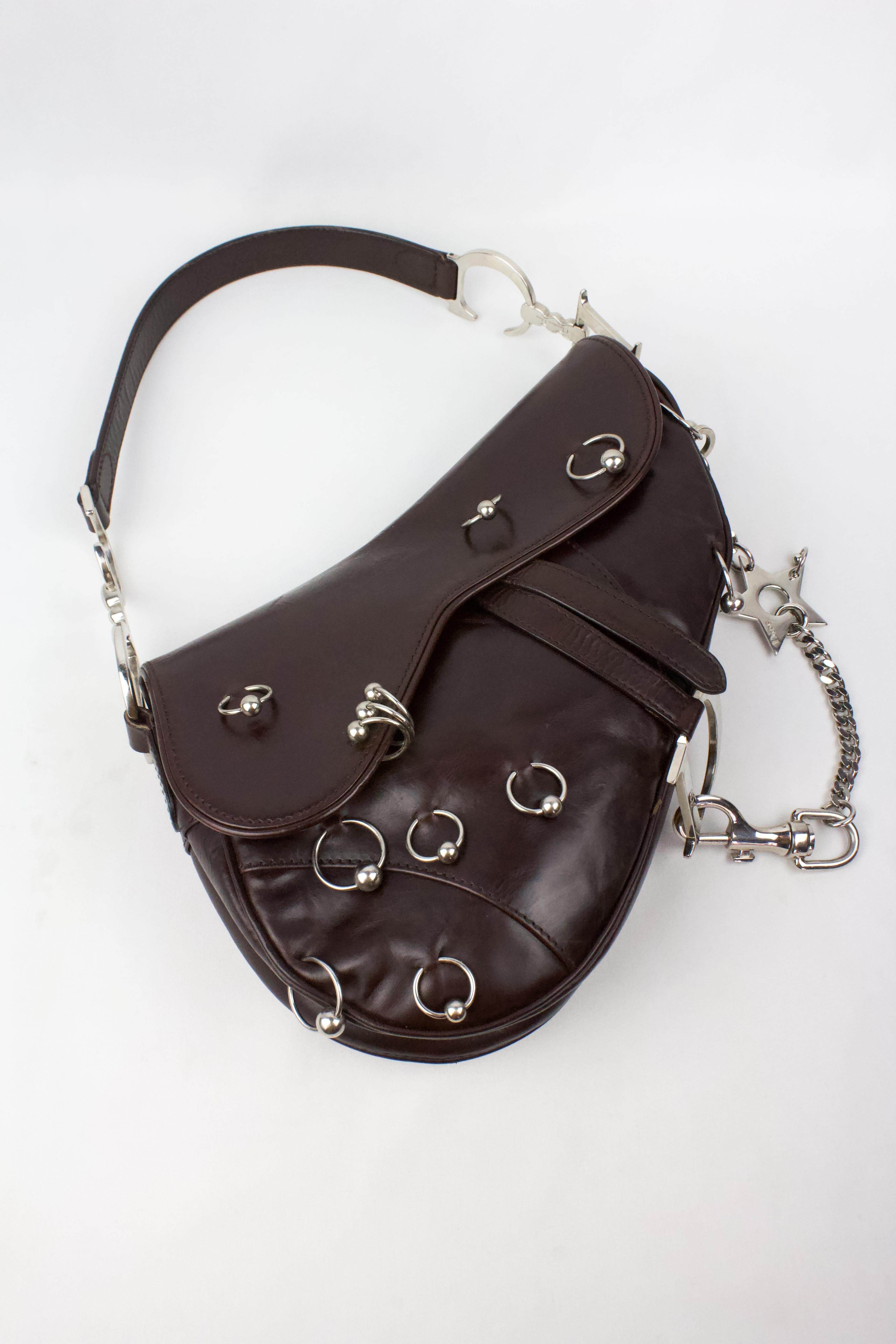 Rare vintage Christian Dior saddle bag, limited 'Hardcore' edition designed by John Galliano. As seen on Gisele Bündchen, who was photographed by Nick Knight wearing it for the Spring/Summer 2004 Dior campaign. Dark burgundy coloured leather with