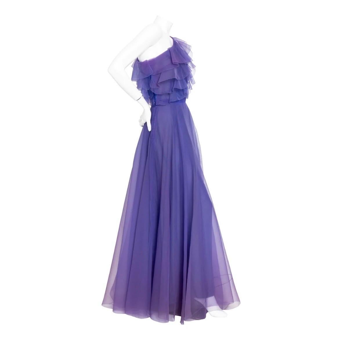 Haute couture silk organza gown by Christian Dior
Autumn/Winter 1972 Collection
Floor length
One Shoulder
Ruffled bodice
Blue lining topped with lightweight purple organza; gives chameleon-like effect
High waist
Material: silk; no content