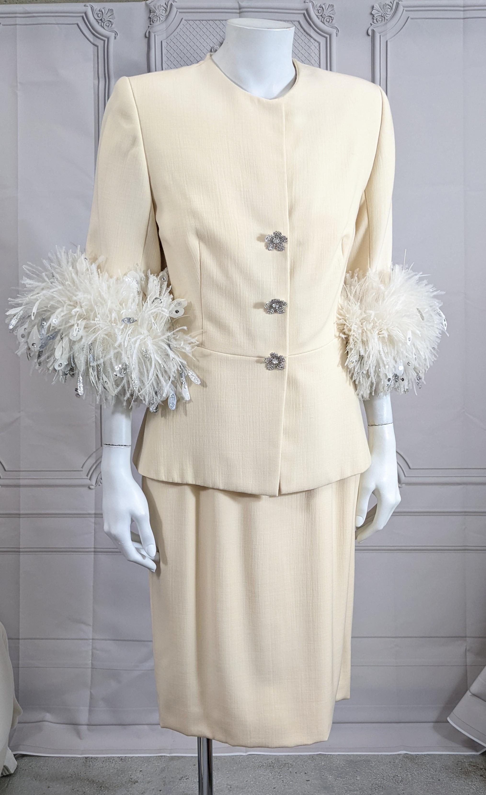 Christian Dior Haute Couture Wool and Feather Trimmed Suit by Gianfranco Ferre. Ivory wool is lined in silk, with 2 extravagant cuffs of varied white feathers, hand painted in silver with hand applied silver sequins for sparkle. Handmade diamonte