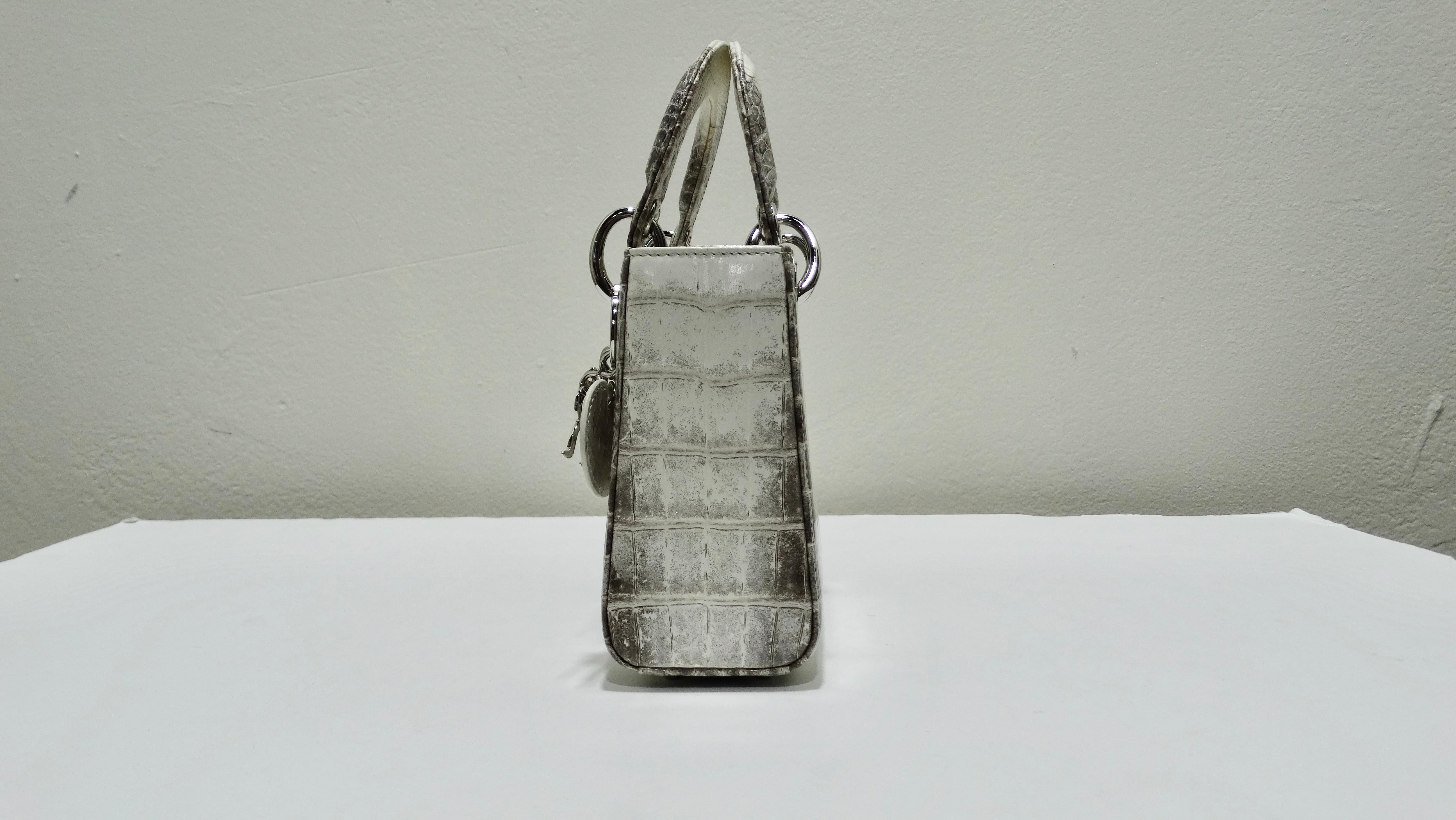 Have your very own Cinderella moment with this extremely unique Christian Dior Himalayan Crocodile Lady Dior Mini Handbag. Its sleek and distinct look portrays the princess look similar to how it was when the bag was first given to Princess Diana.
