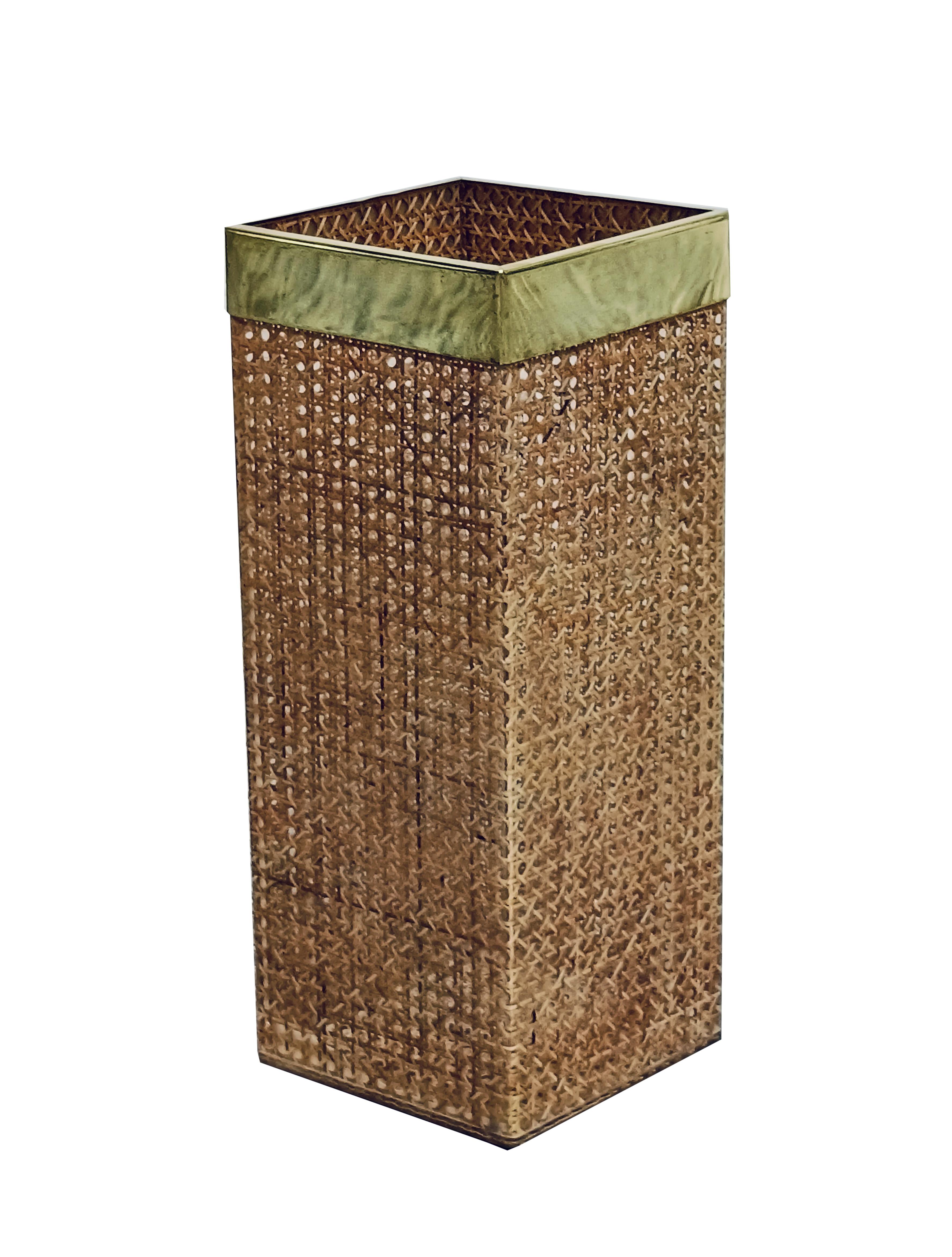 This graceful umbrella stand was designed in the style of the Christian Dior Home Collection in the 1970s. The geometric shape boasts a gilded brass gallery and real rattan or wicker set in crystalline lucite. It is an ideal desk or home accessory