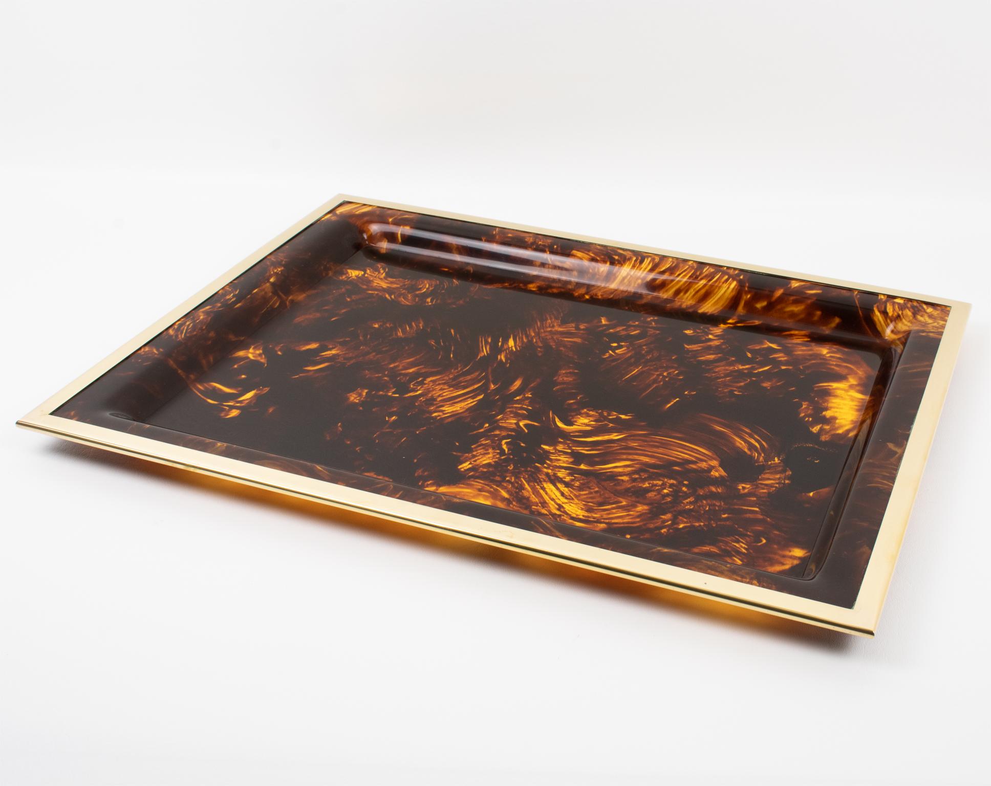 This stunning Mid-Century modernist barware serving tray or platter was crafted in Italy for the Christian Dior Home collection in the 1970s. The large rectangular shape boasts a raised Lucite insert with faux tortoiseshell (tortoise) textured