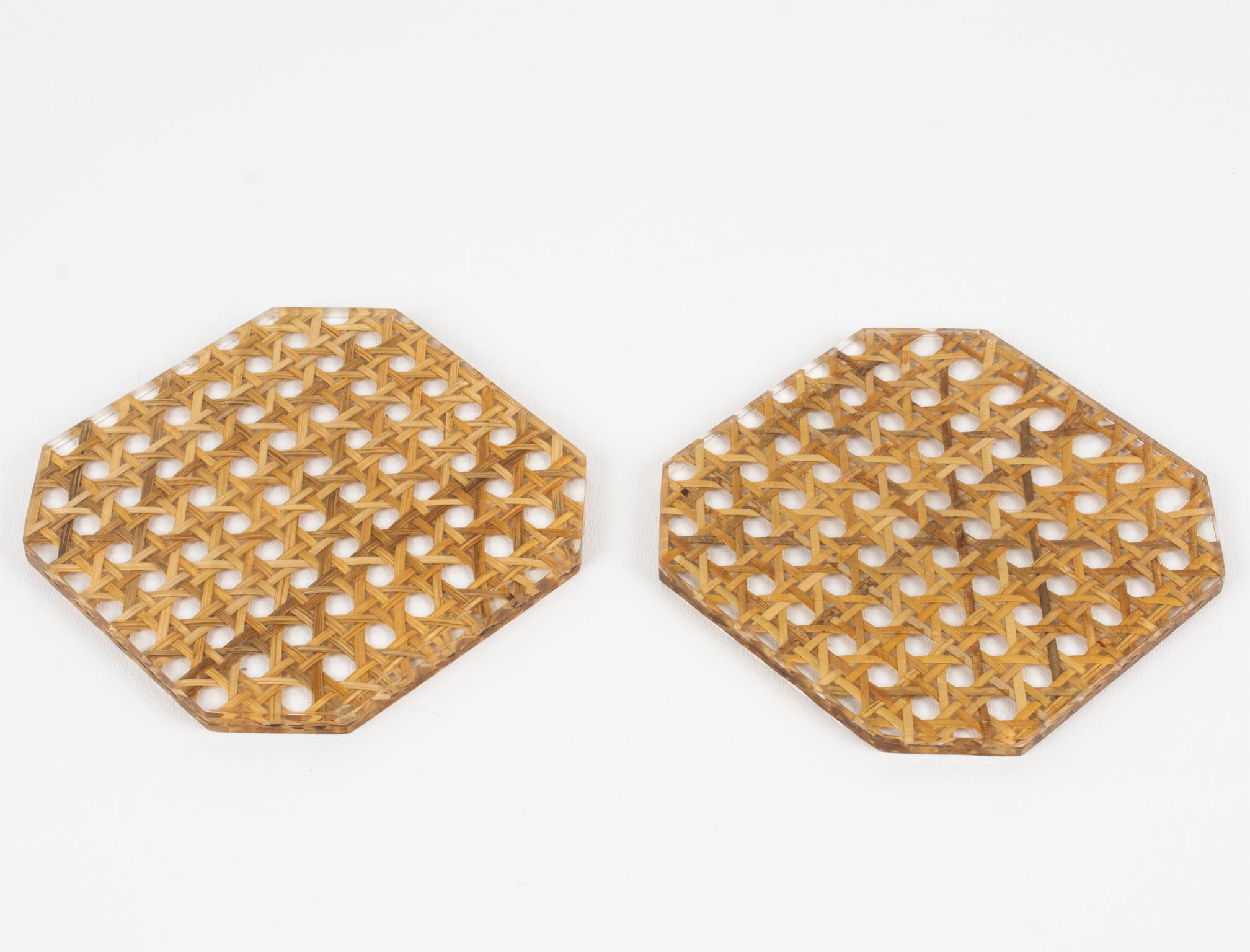 This elegant barware coasters set was designed for the Christian Dior Home Collection in the 1970s. They feature a square shape with cut corners in crystal clear Lucite or acrylic with genuine rattan, wicker, or cane-work embedded in the material.