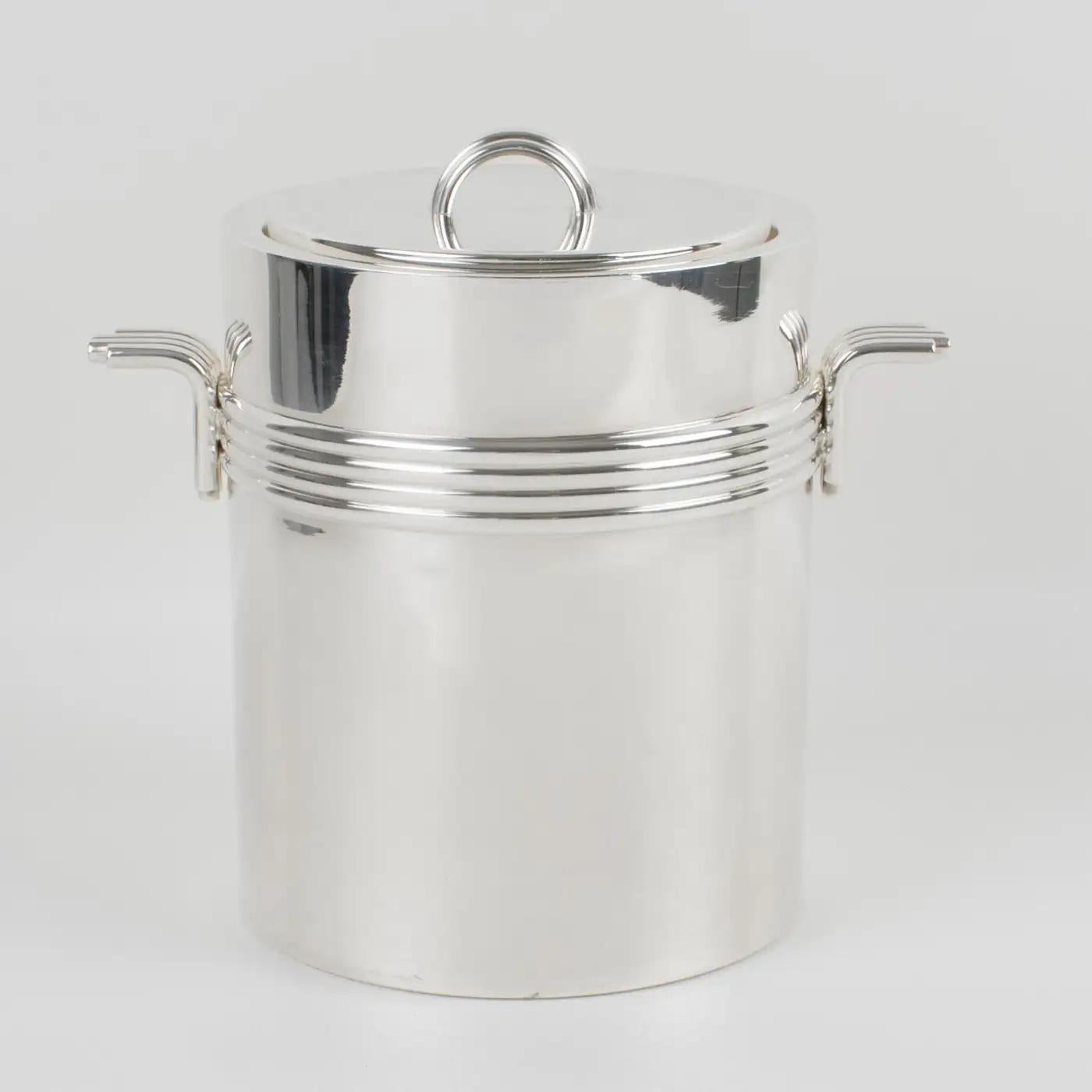 Christian Dior, Paris, designed this modernist lidded ice bucket or wine cooler. This sophisticated silver-plate ice bucket features an iconic streamlined design with concentric rings and clean lines. The piece is marked underside 