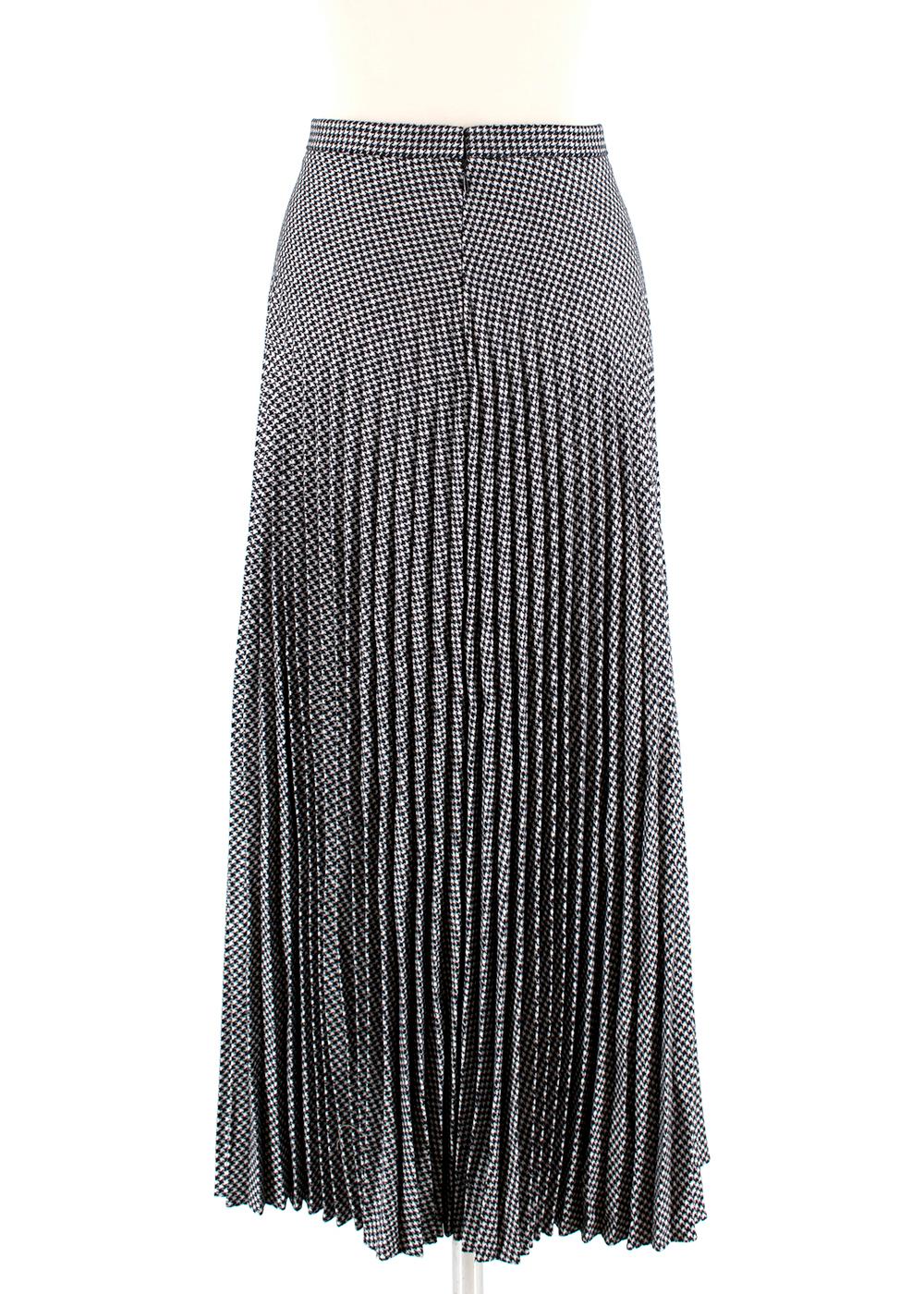 Christian Dior Houndstooth Pleated Skirt  

- Side Concealed Zip and Hook Clasp Closure 
- Fully Lined 
- Soft Pleats 
- Tailored Waistband 
- Floor Length

Materials:
- 75% Wool 
- 25% Polyester 
- 100% Silk Lining 

Made in Italy 

Waist: