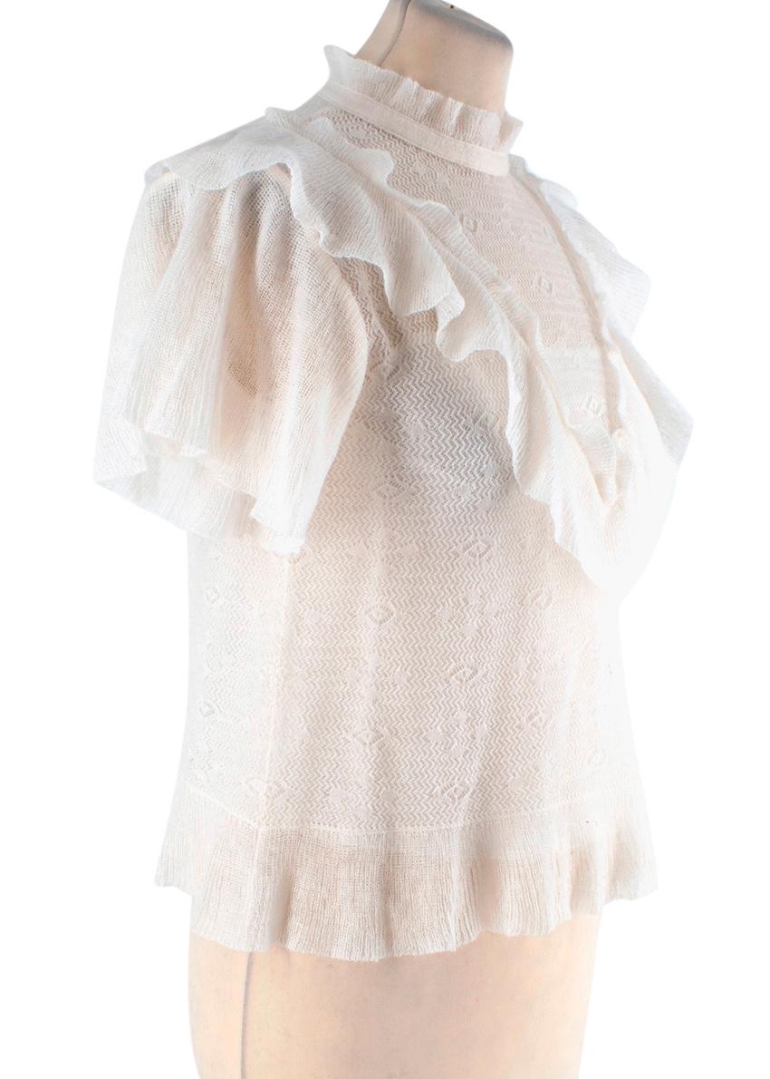 Christian Dior Ivory Mohair-Blend Pointelle Knitted top

- Lightweight, fluffy pointelle knit featuring a decorative open weave
- Tonal silk camisole lining
- Band collar
- Ruffled yoke and hem

Materials 
47% Polyamide 
37% Mohair 
16% Wool 

Made