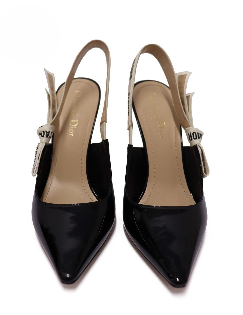 Christian Dior J'adior Slingback Pump in Black Patent Leather, with a two-tone embroidered 'J'ADIOR' ribbon embellished with a flat bow.

Material: Leather.
Size: EU 39.5
Heel Height: 10cm
Condition: New.
*Includes Original Box