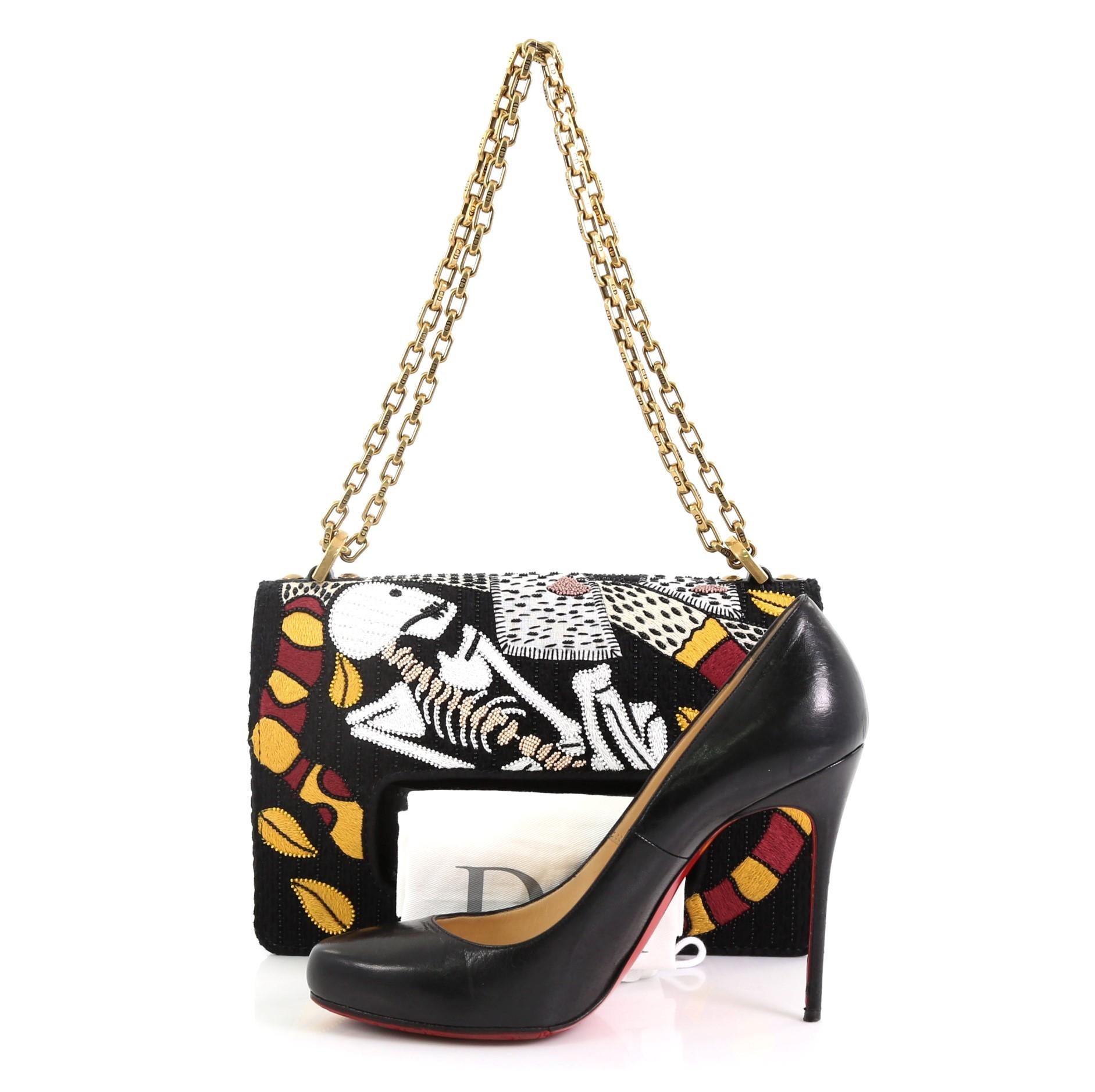 This Christian Dior J'adior Tarot Flap Bag Embroidered Fabric Medium, crafted from multicolor embroidered black fabric, features chain link strap, slot handclasp with metal plated J'adior signature, Motherpeace Tarot 