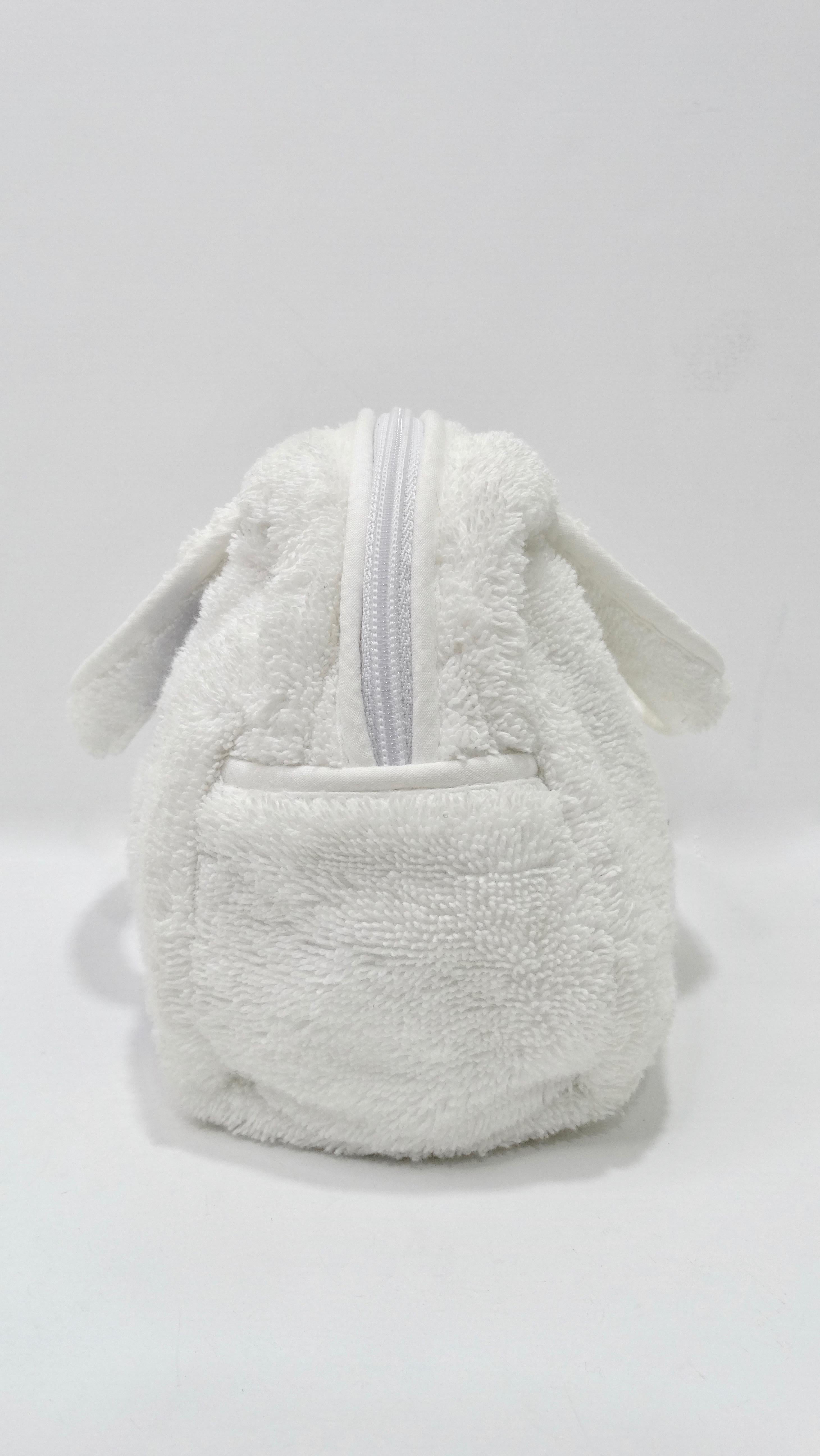 Too dior-able to pass up! Designed by Galliano for Dior circa 1990s, this mini handbag is crafted from white terry cloth and is embroidered with 'J'adore Dior' in blue lettering. Features dual top handles, a top zipper closure and a lined interior