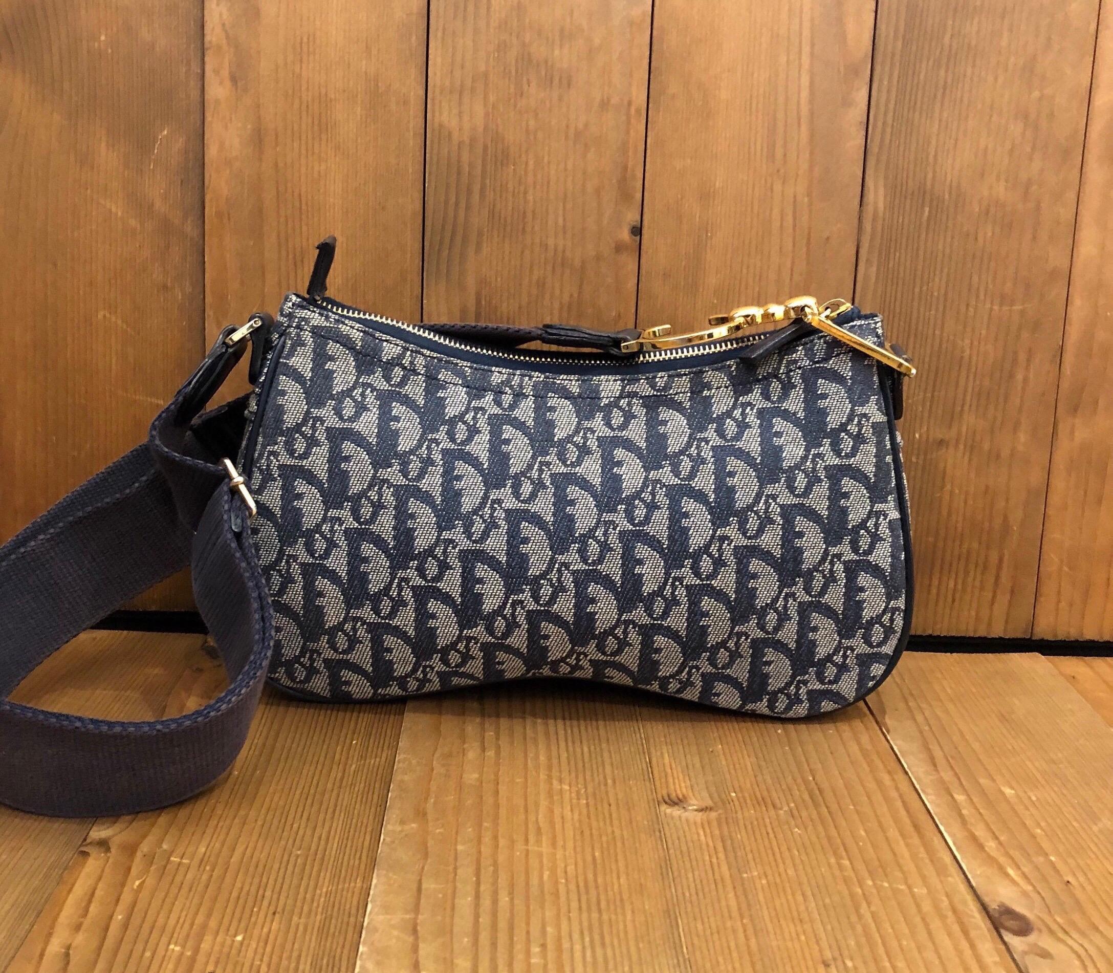 CHRISTIAN DIOR John Galliano Double Saddle Crossbody Bag Unisex
Material: Jacquard/leather 
Color: Navy
Origin: Italy
Measurements: 10.5”x6”x2.25” Strap drop: 14” adjustable to 21”
Specifications: 1 interior zip pocket/1 exterior zip flap pocket