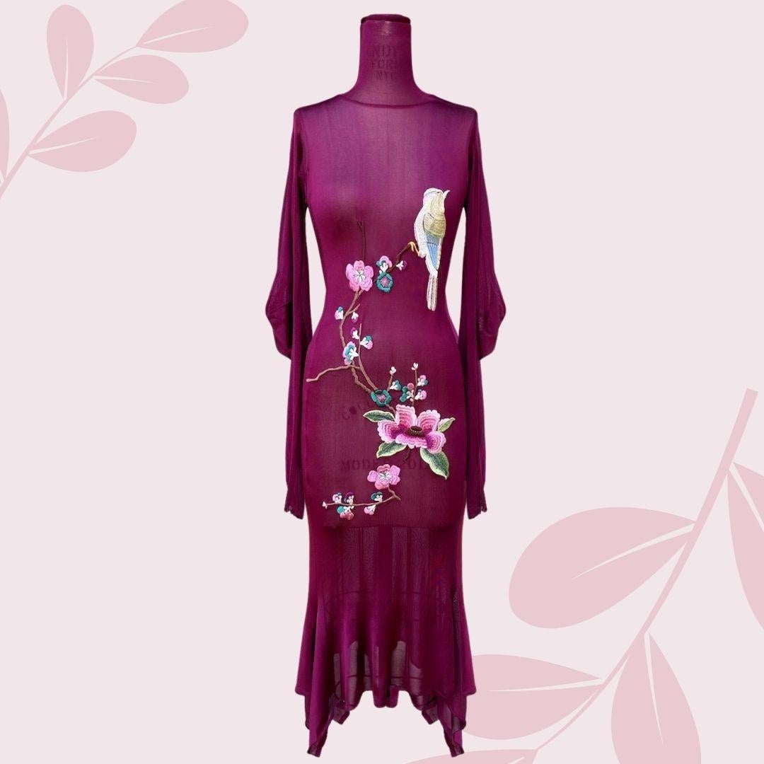 John Galliano for Christian Dior Embroidered Cherry Blossom Dress. This dress is formfitting with a geometric hem, mock turtleneck and flowing upper sleeves that taper at the bottom for a close fit.  Button closure in the back.
Fabric: 100%