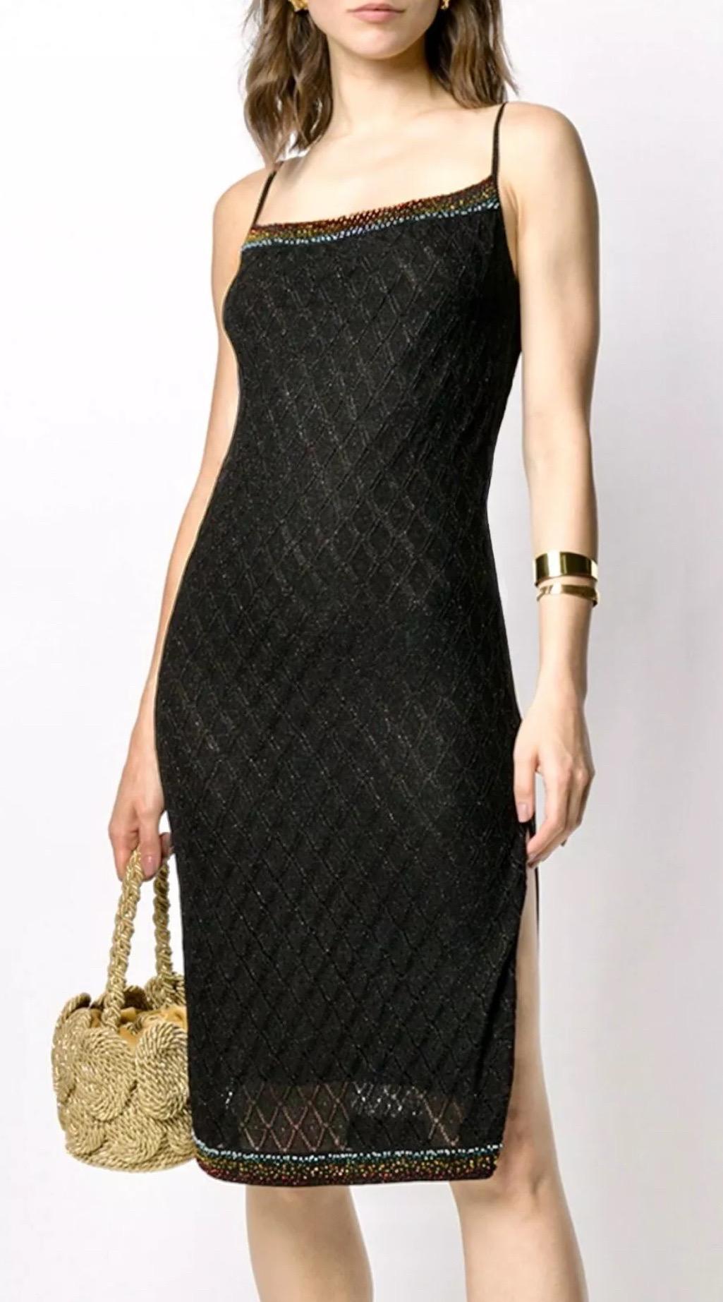 A chic find from Christian Dior’s Fall/Winter 2001 collection under John Galliano. Made from black stretch lurex knit, this slip dress features subtle lattice detailing through the bodice and multicolor beaded trim. The silhouette is easy and