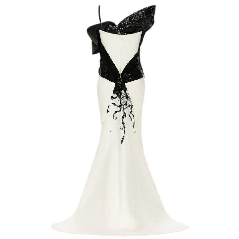 dior mermaid dress DIOR  Dior wedding dress is the embodiment of seduction and softness. An  elegant bustier with open shoulders, gorgeous details of the dress and  translucent sleeves