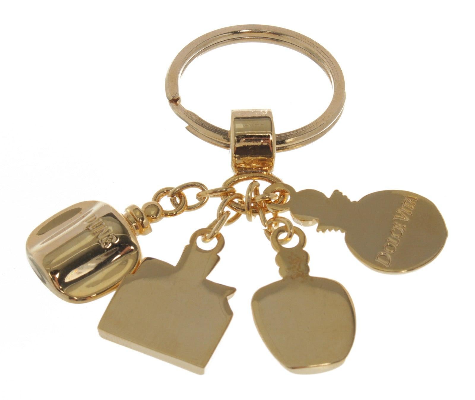 Christian Dior key chain with four pendants, gold-tone hardware.





 

54700MSC
