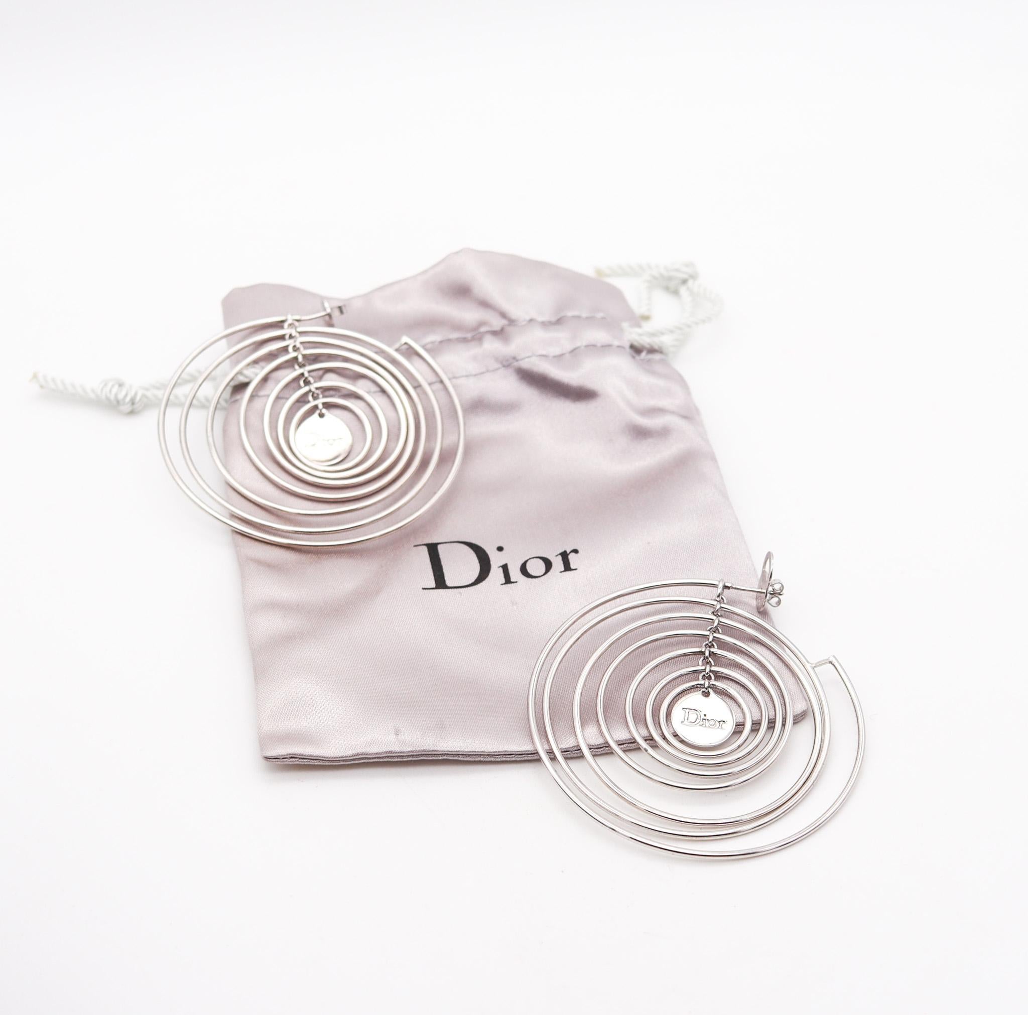 kinetic sculptural circles earrings designed by Christian Dior.

Fabulous kinetic dangle earrings, created in Paris France at the atelier of Christian Dior. These ultra modernist earrings are very artistic and has been crafted in solid .925/.999