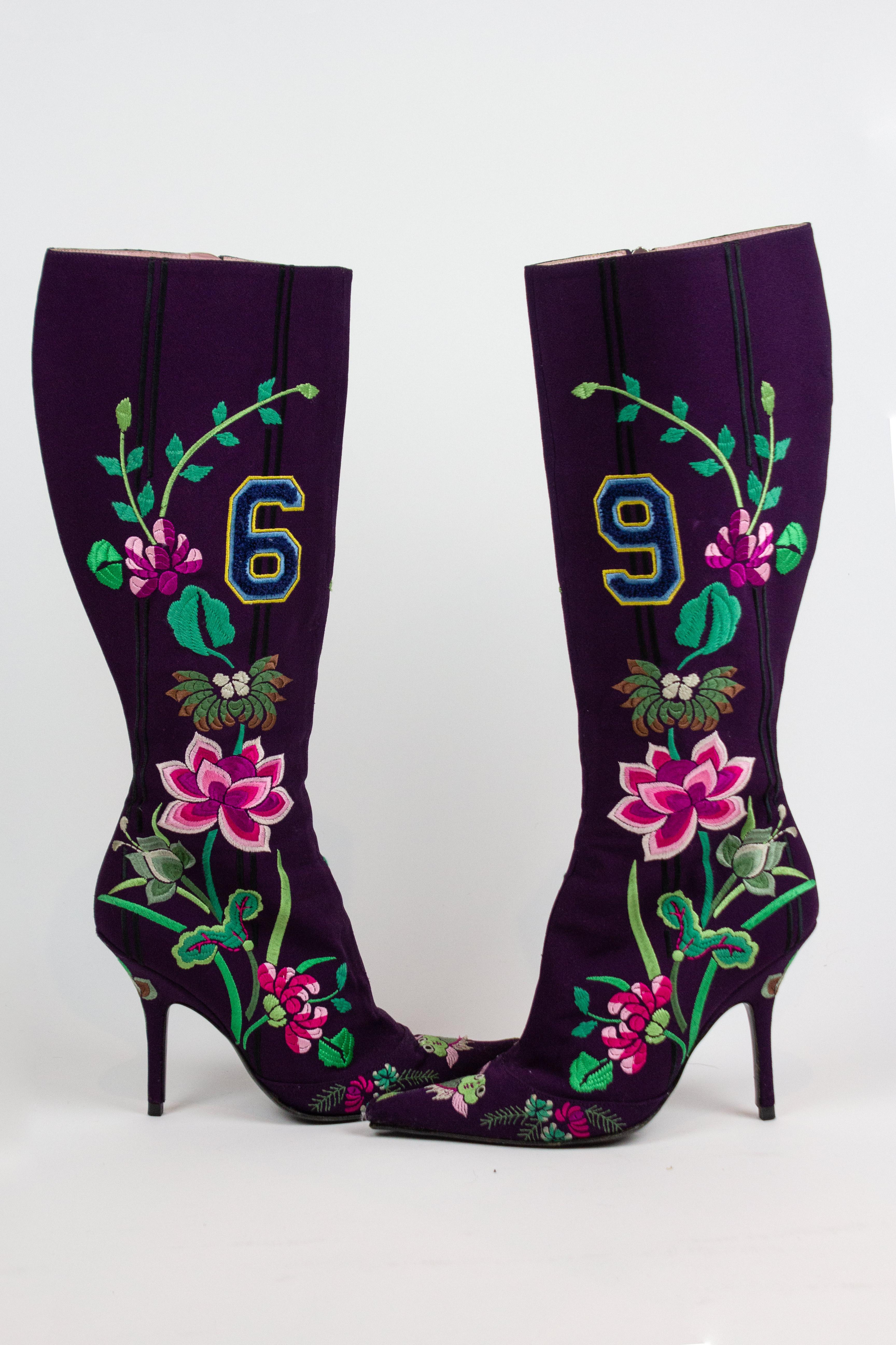 Christian Dior by John Galliano purple suede boots, with floral and koi fish embroidery. Print as featured on the Fall/Winter 2003 runway.

Condition
Very good. No major flaws. One heel has very slight seperation from the sole. Slight wear to soles.