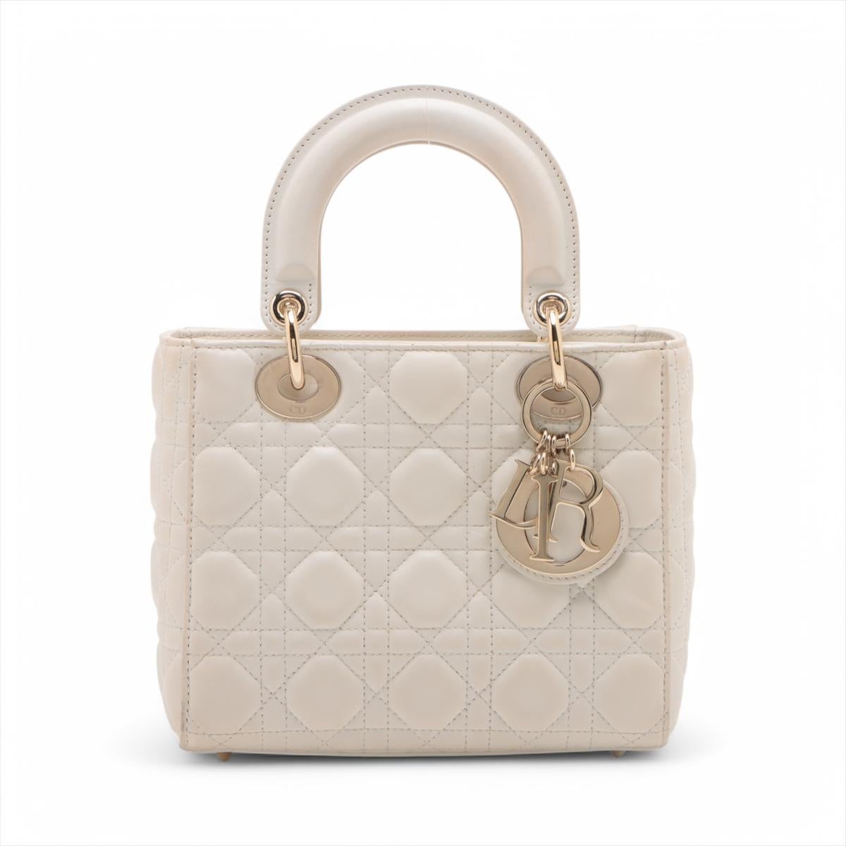 *will ship about 4/1

The Christian Dior Lady Dior Cannage Leather Handbag in White is a timeless symbol of elegance and luxury. Crafted from smooth white lambskin leather, it features the iconic Cannage quilting pattern, adding texture and