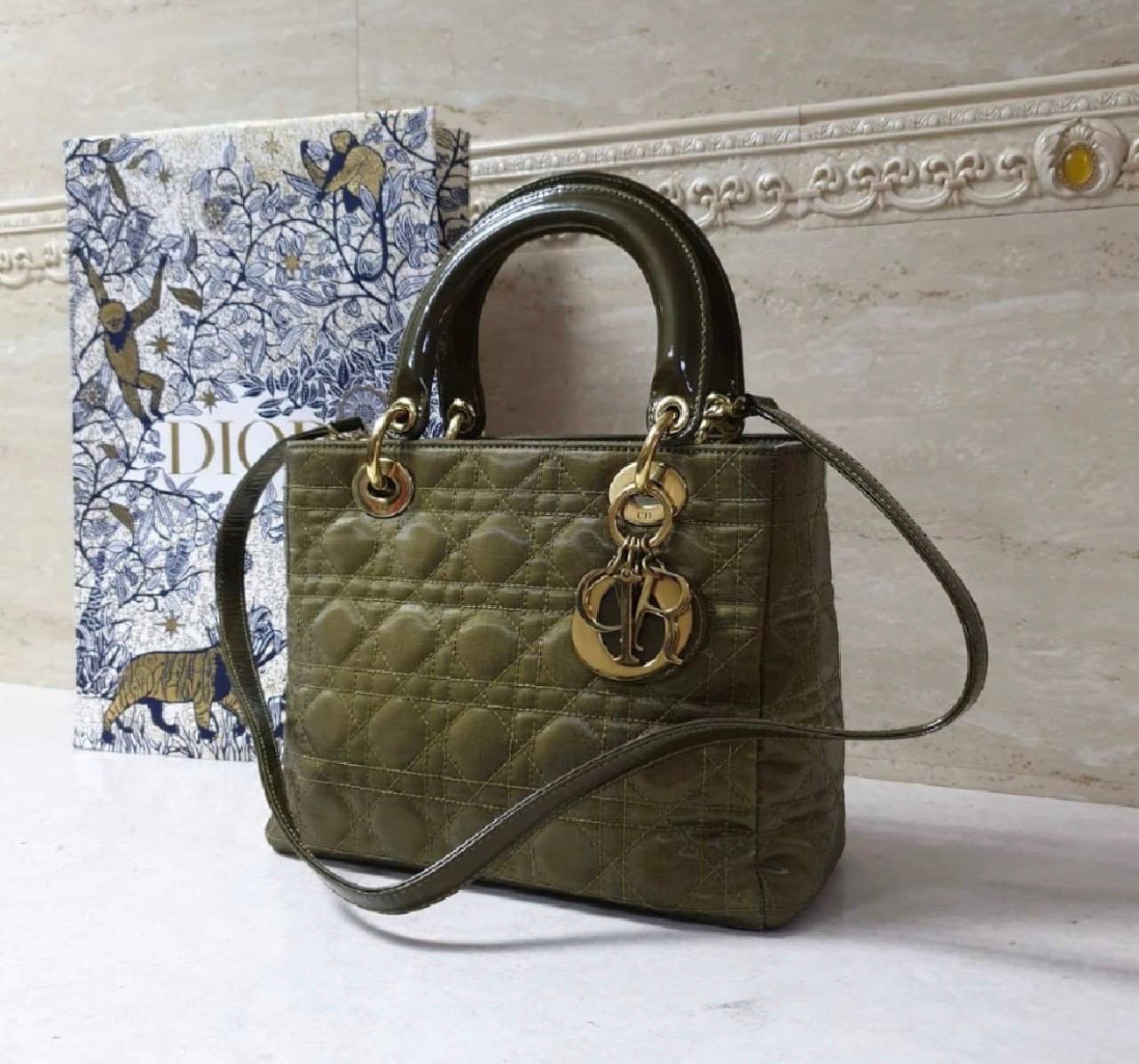 Christian Dior Lady Dior Medium Khaki Canvas Bag 
Lady Dior bag in light khaki canvas stitched with the iconic Cannage pattern with handles and strap in patent leather and gold metal hardware.
Chocolate canvas interior with a zipped