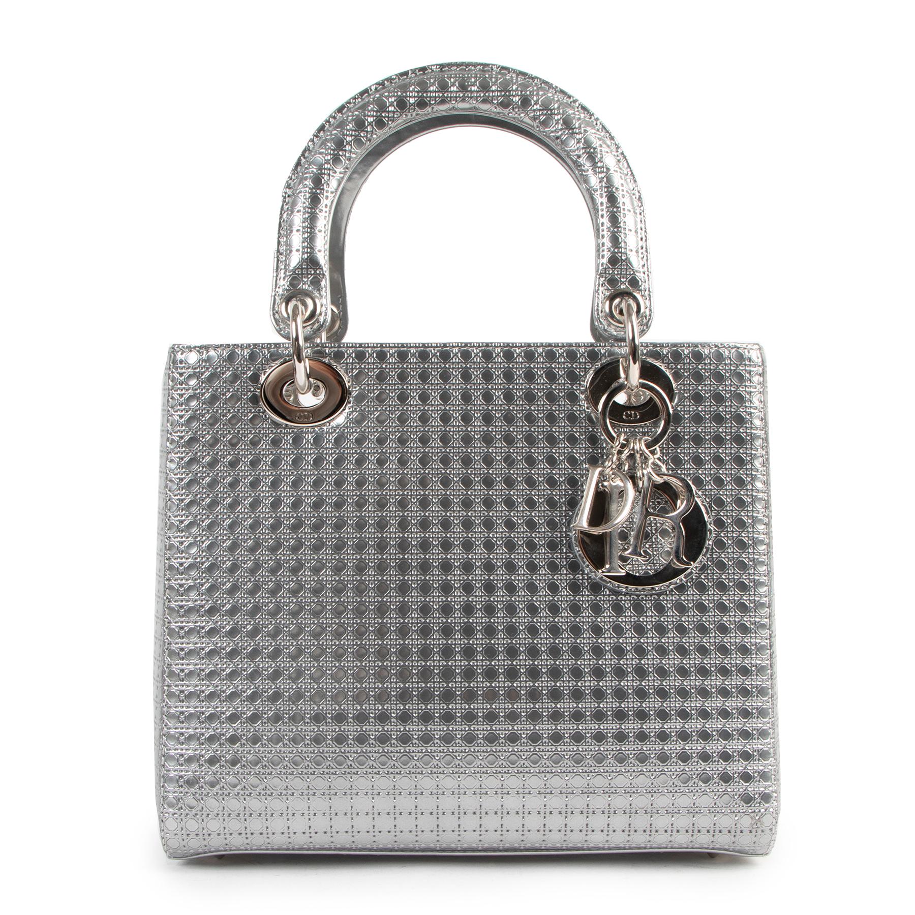 Christian Dior Lady Dior Medium Silver Micro Cannage Bag

The Lady Dior handbag embodies Maison Dior's elegance and beauty.

This sleek and refined style is crafted in silver metallic leather and embossed with Micro Cannage pattern for evening