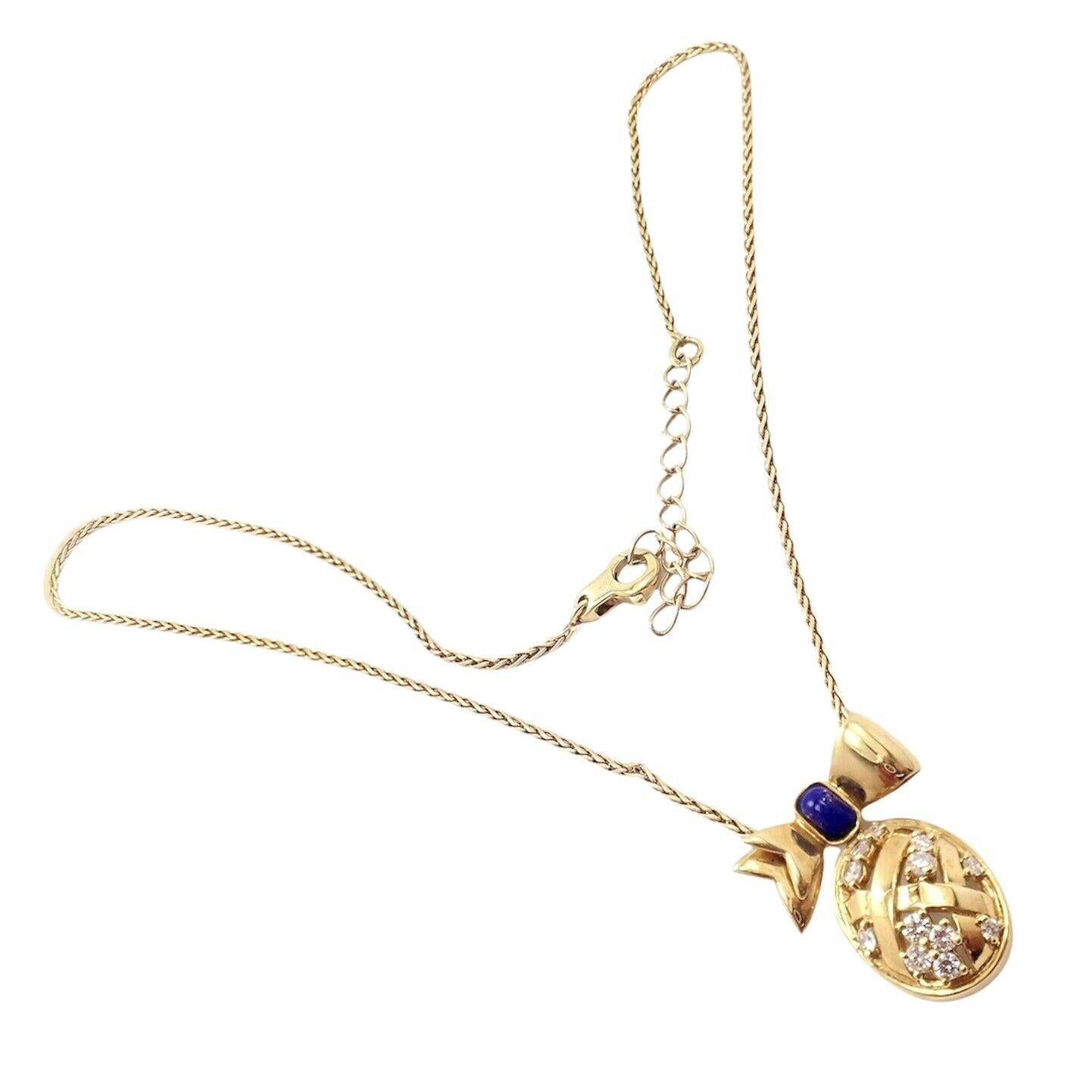 18k Yellow Gold Diamond Bow Pendant Necklace by Christian Dior. 
With 12x round brilliant cut diamonds VVS1 clarity, E color total weight approx. .50ct
1x Lapis 3.3mm x 5mm
Details: 
Weight: 10.7 grams
Length Adjustable: 16