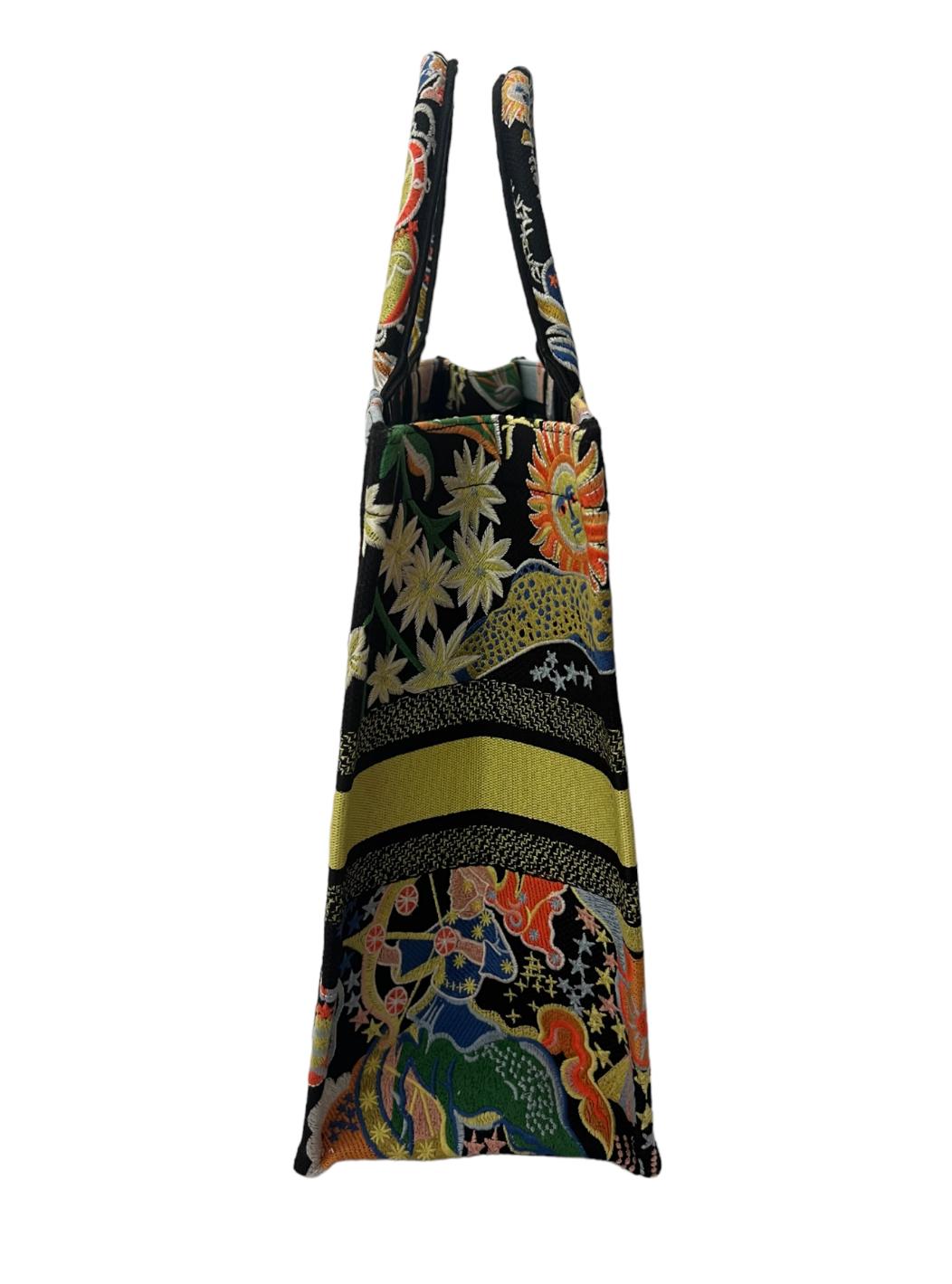 - Multicolored canvas
- Embroidered with zodiac & astrological motif 
- Front Christian Dior Paris signature
- Handles drop 6.25 inches 
- Includes diastolic bag
- Made in Italy